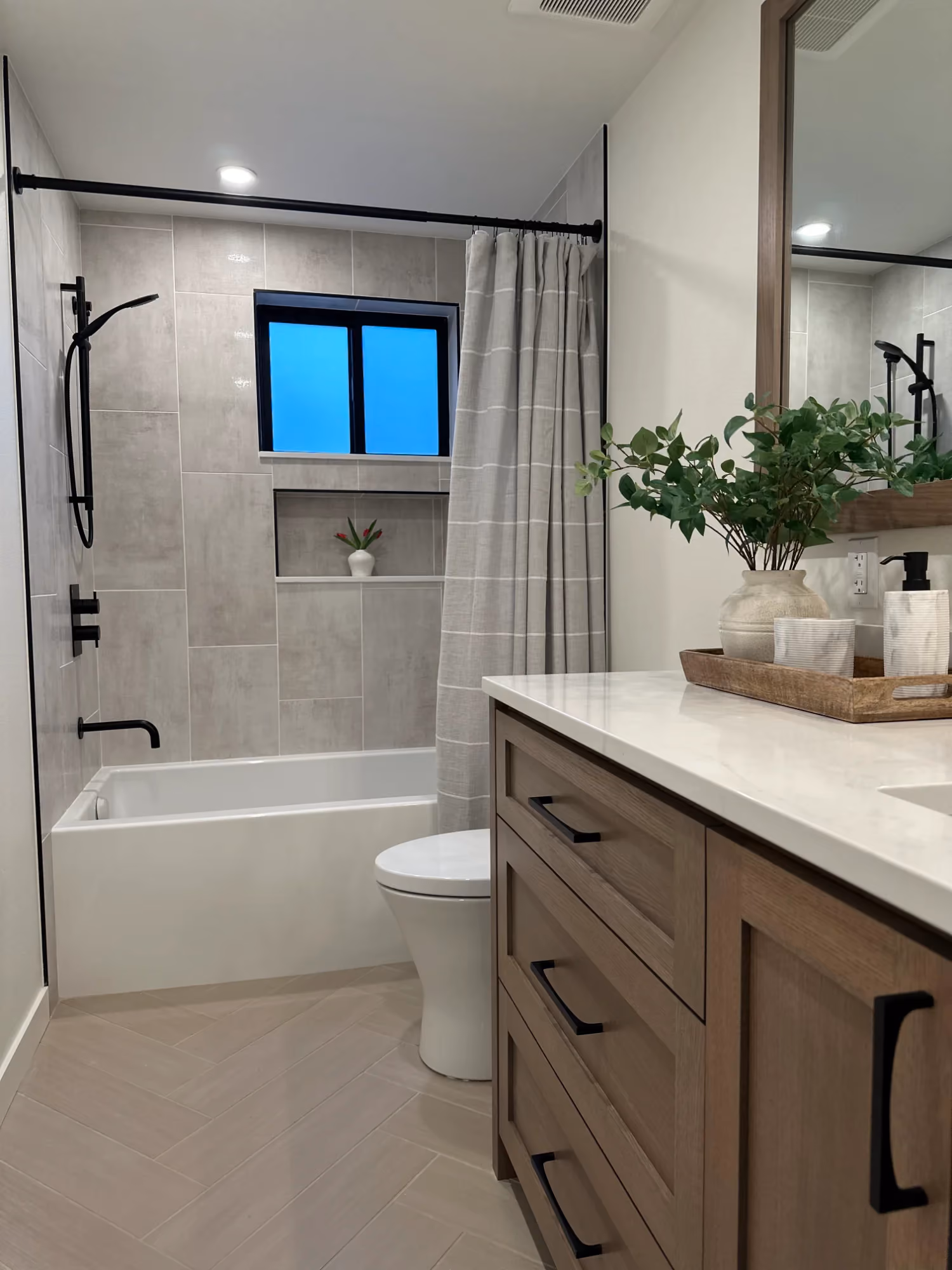 Bathroom vanity with mirror and window