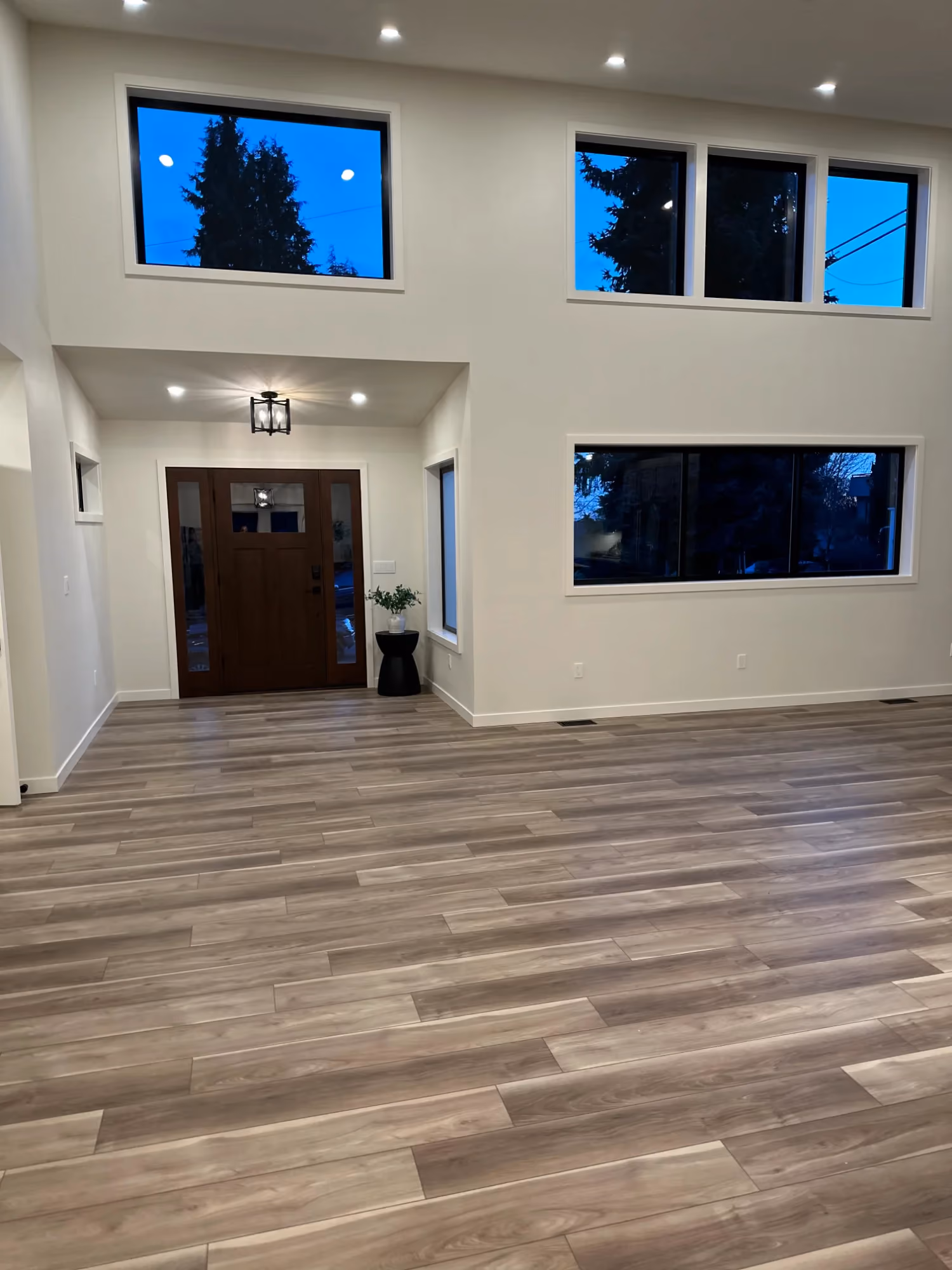 Living room with wall-mounted TV and fireplace