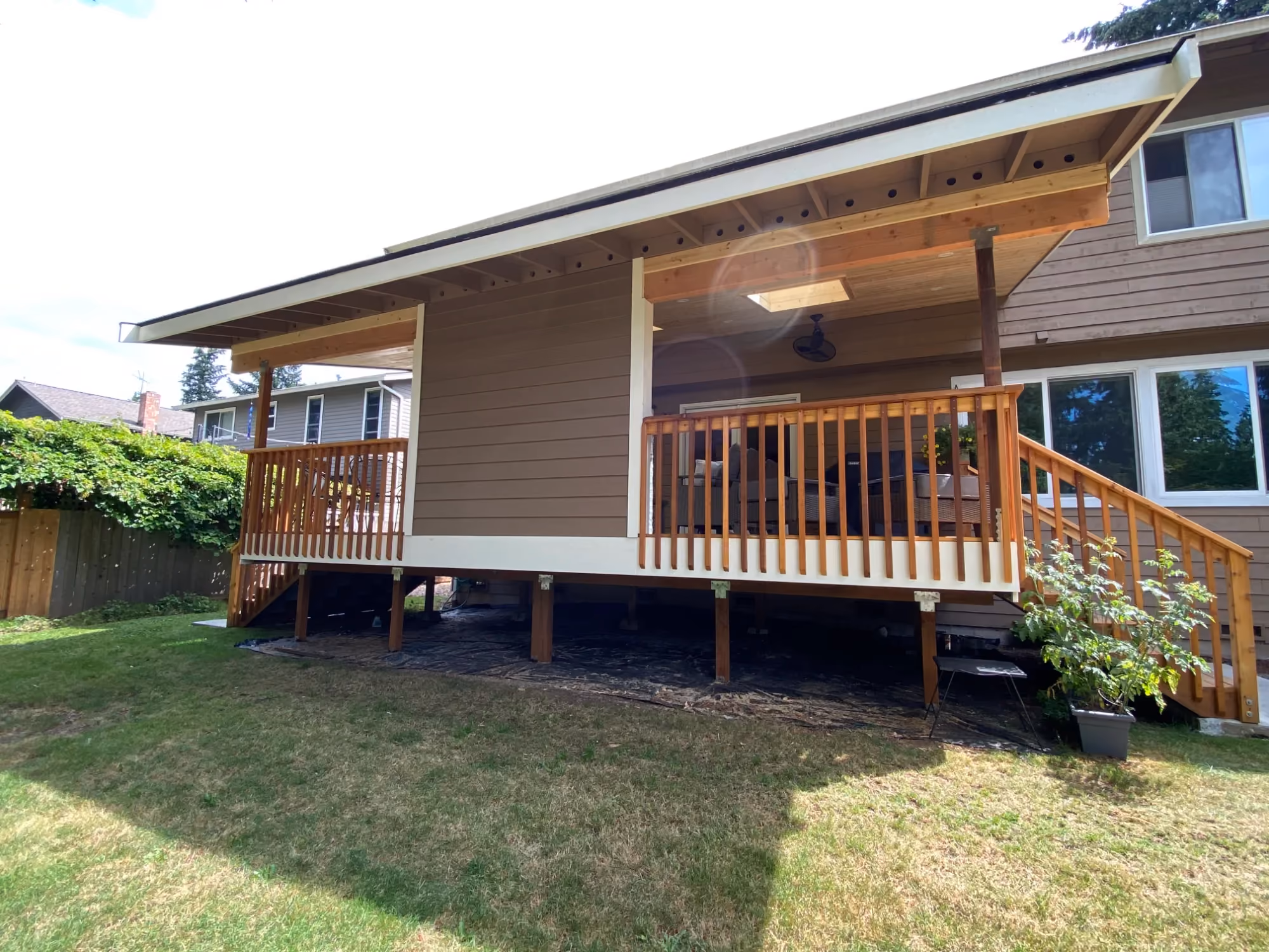 House exterior view with raised wooden deck