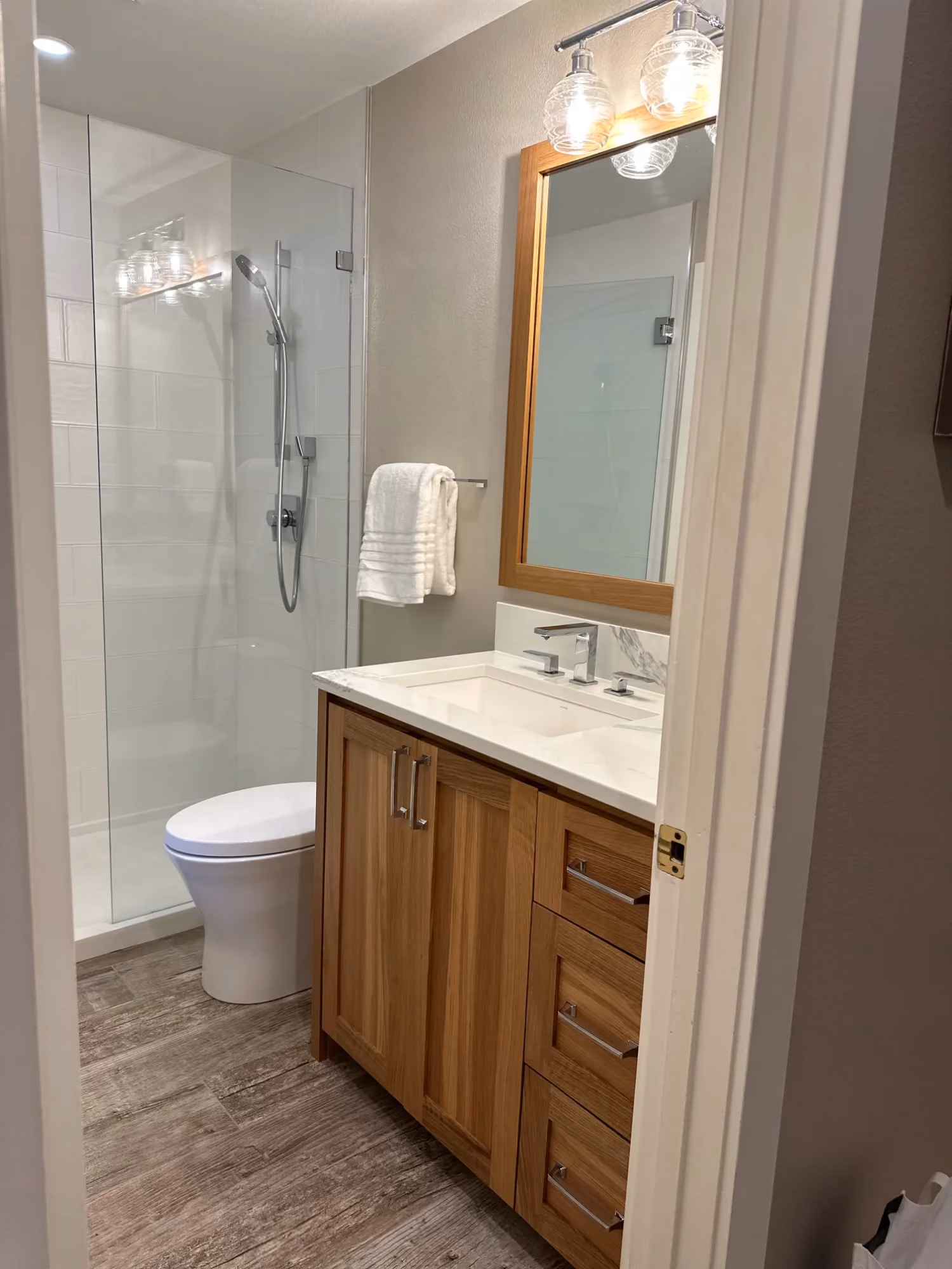 Bathroom vanity with mirror and towel rack