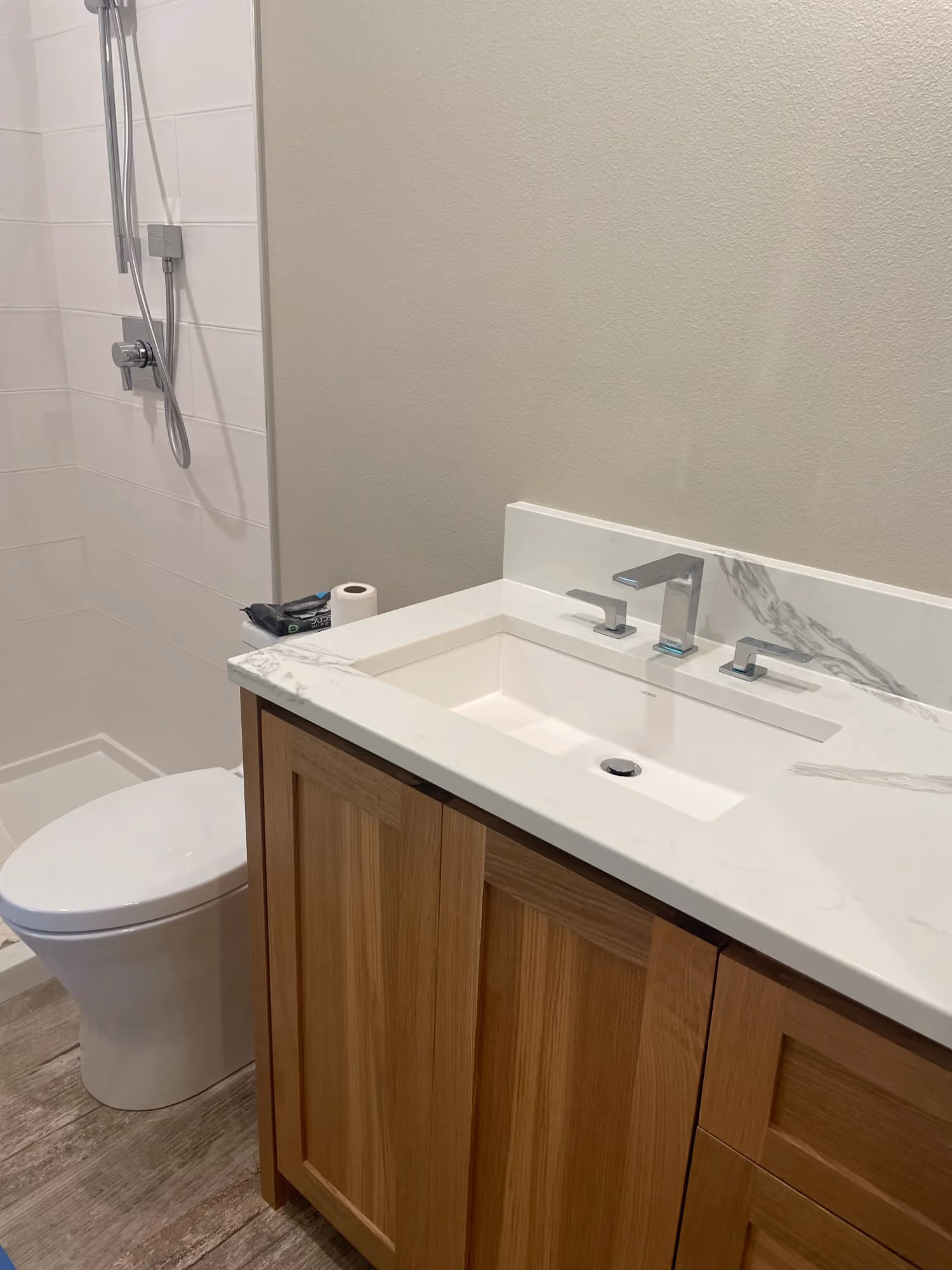 Bathroom vanity with sink and toilet