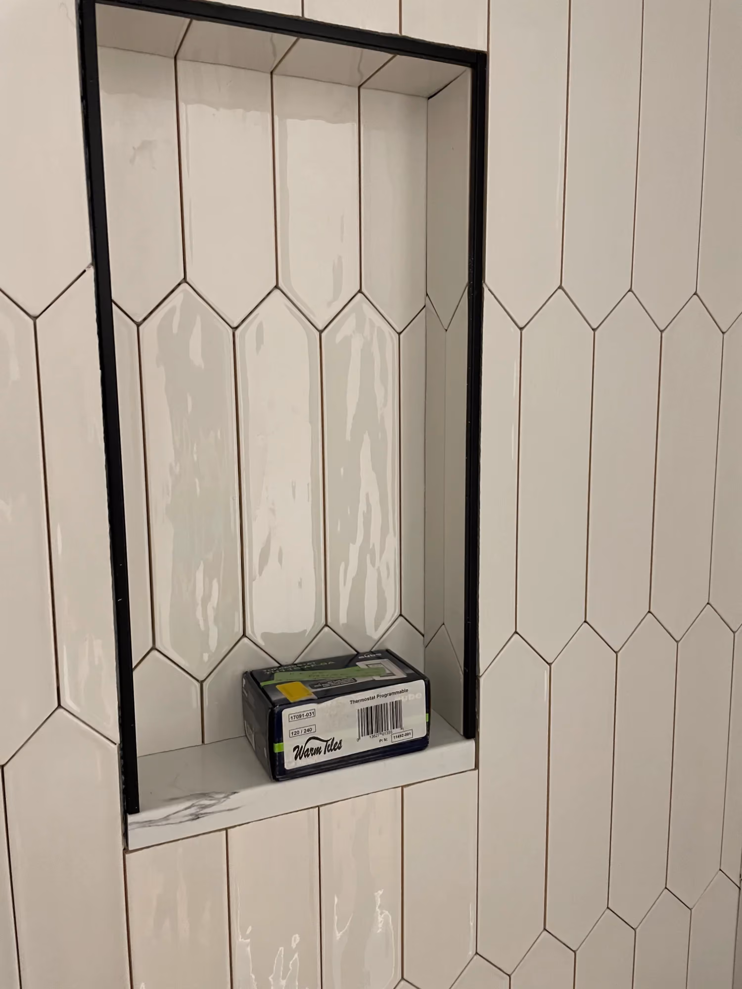 Tiled shower niche with shampoo shelf