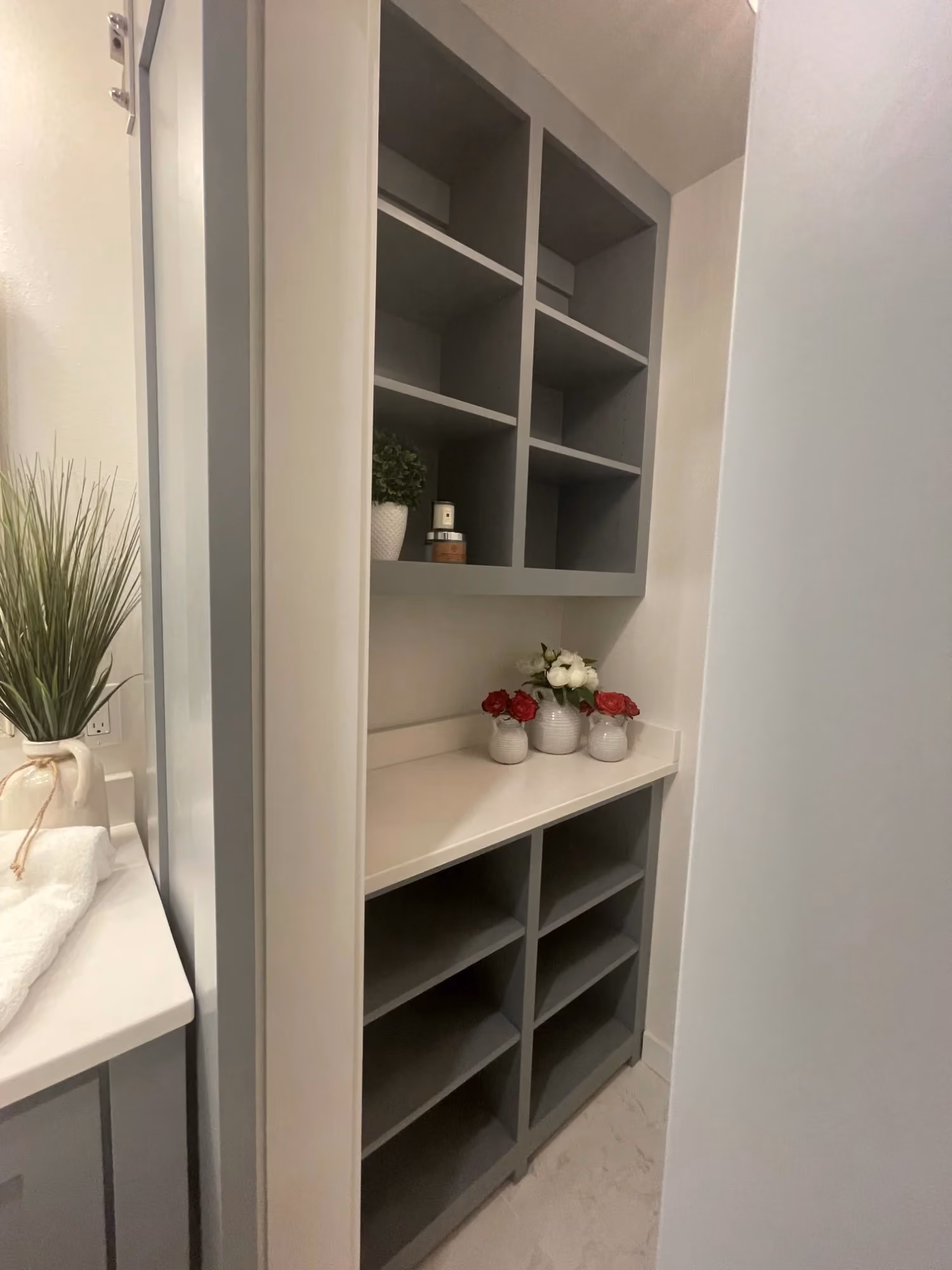 Built-in shelving unit with open cubbies and decor