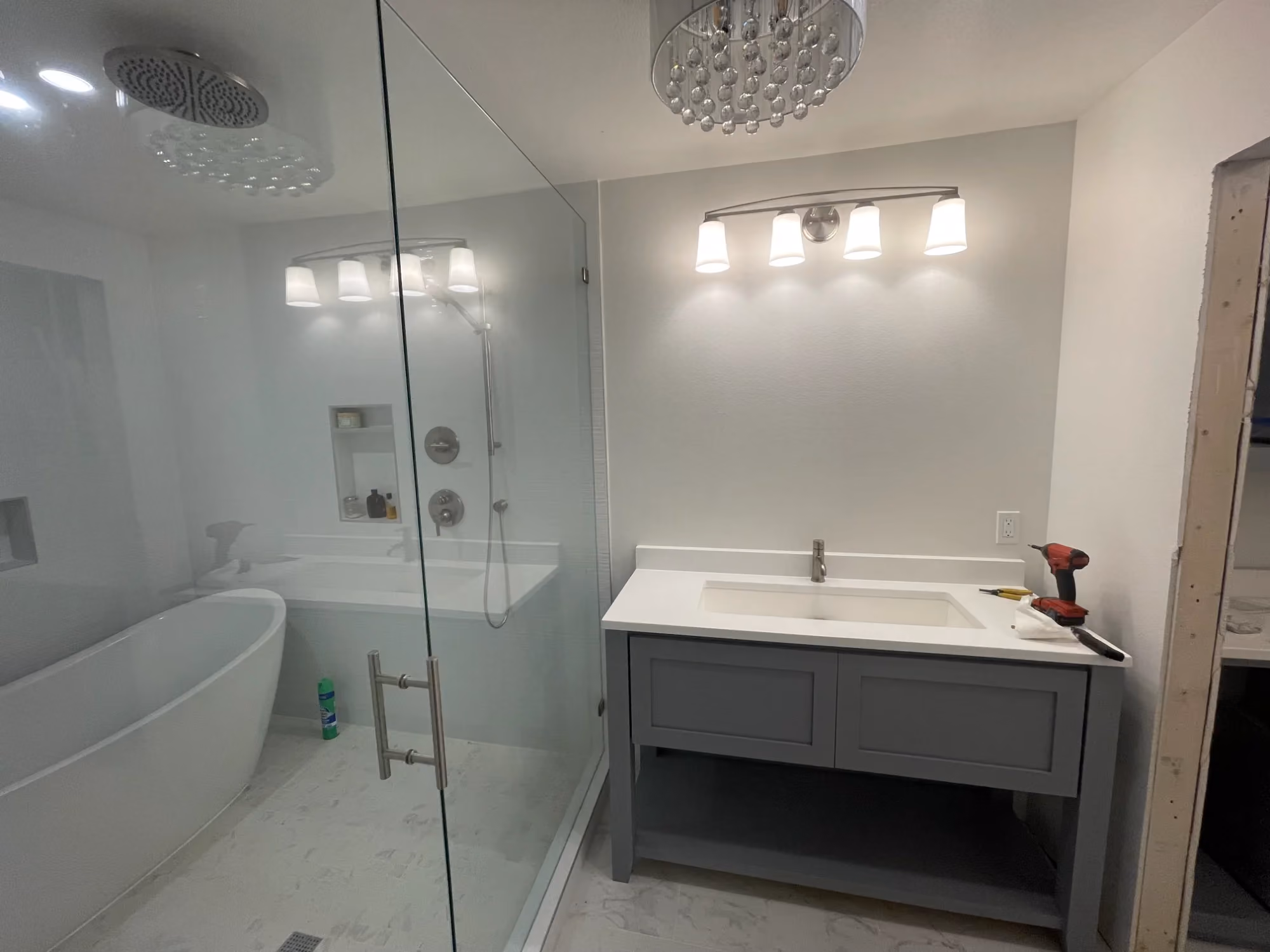 Bathroom with glass shower and vanity lights