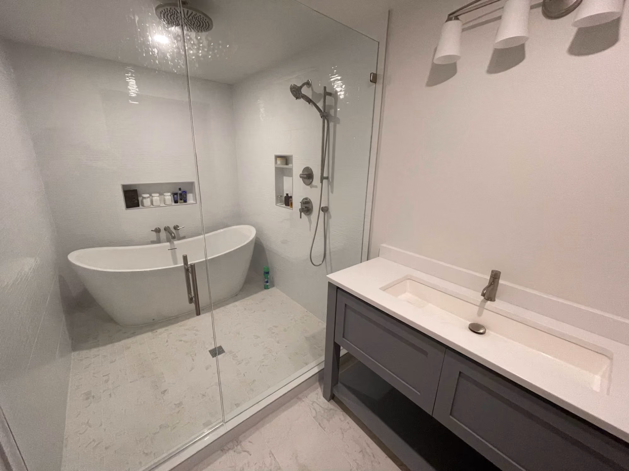 Modern bathroom with double sinks and walk-in shower