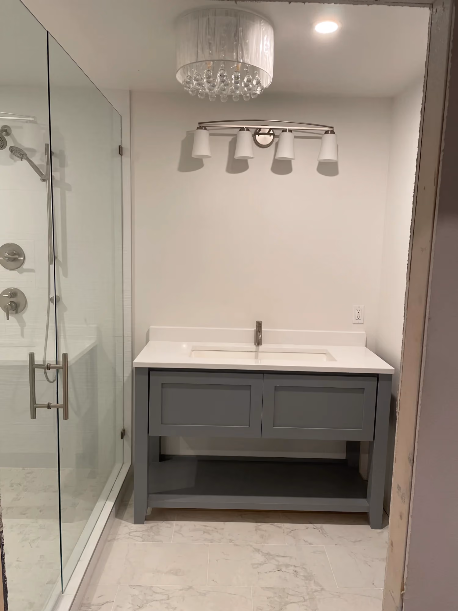 Bathroom vanity and shower with glass door