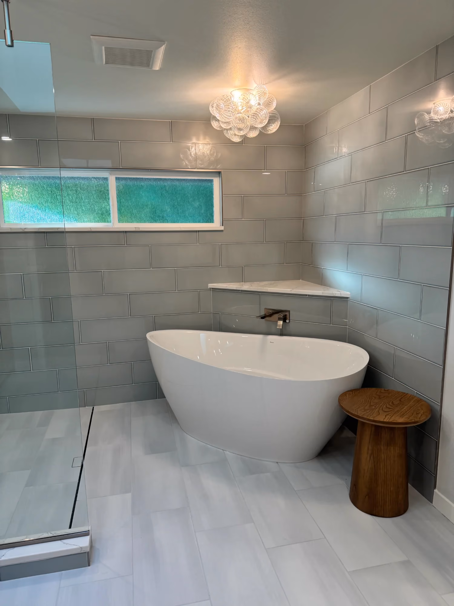 Bathroom with tub and shower surround