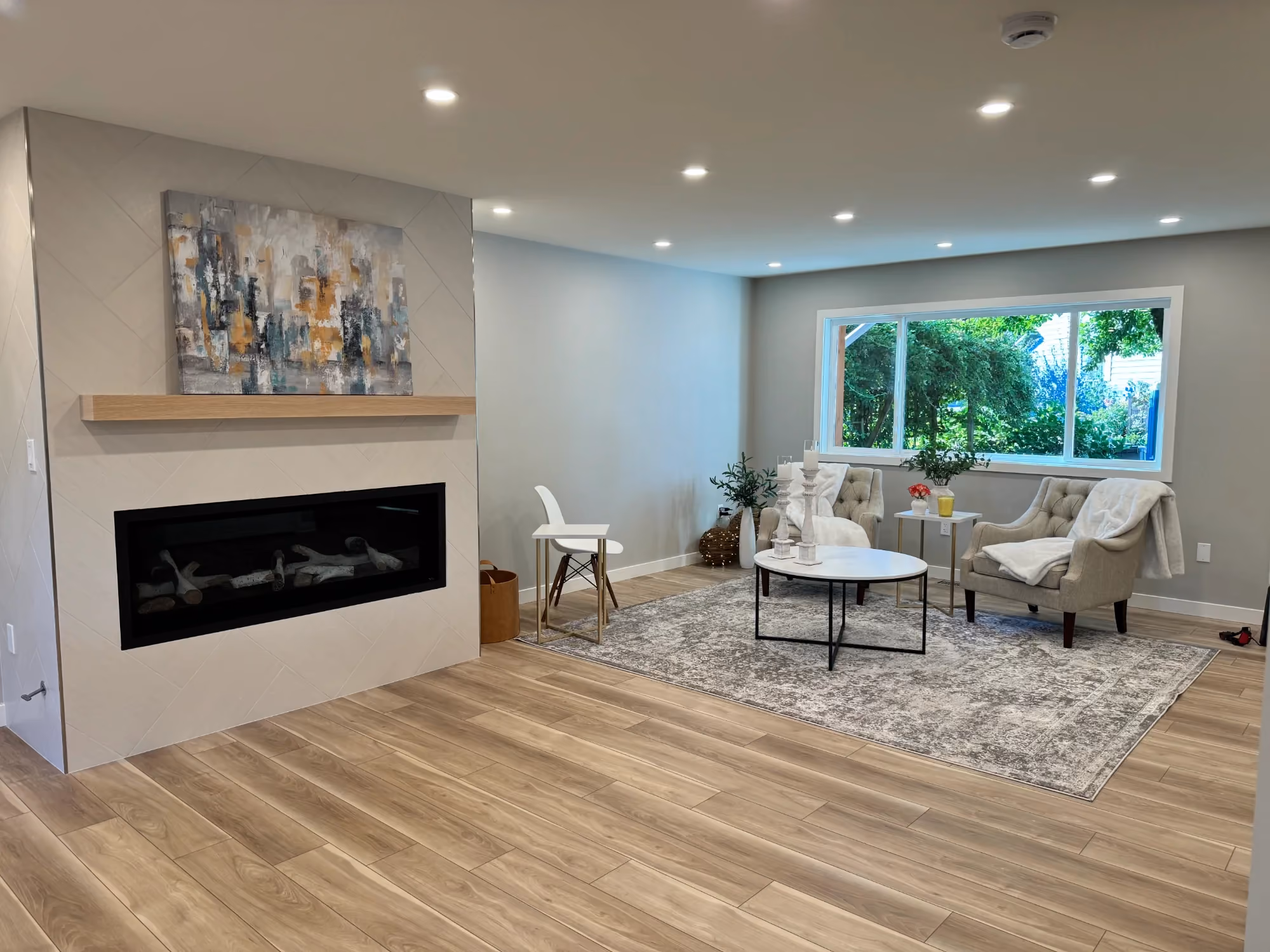 Living room with fireplace and large window