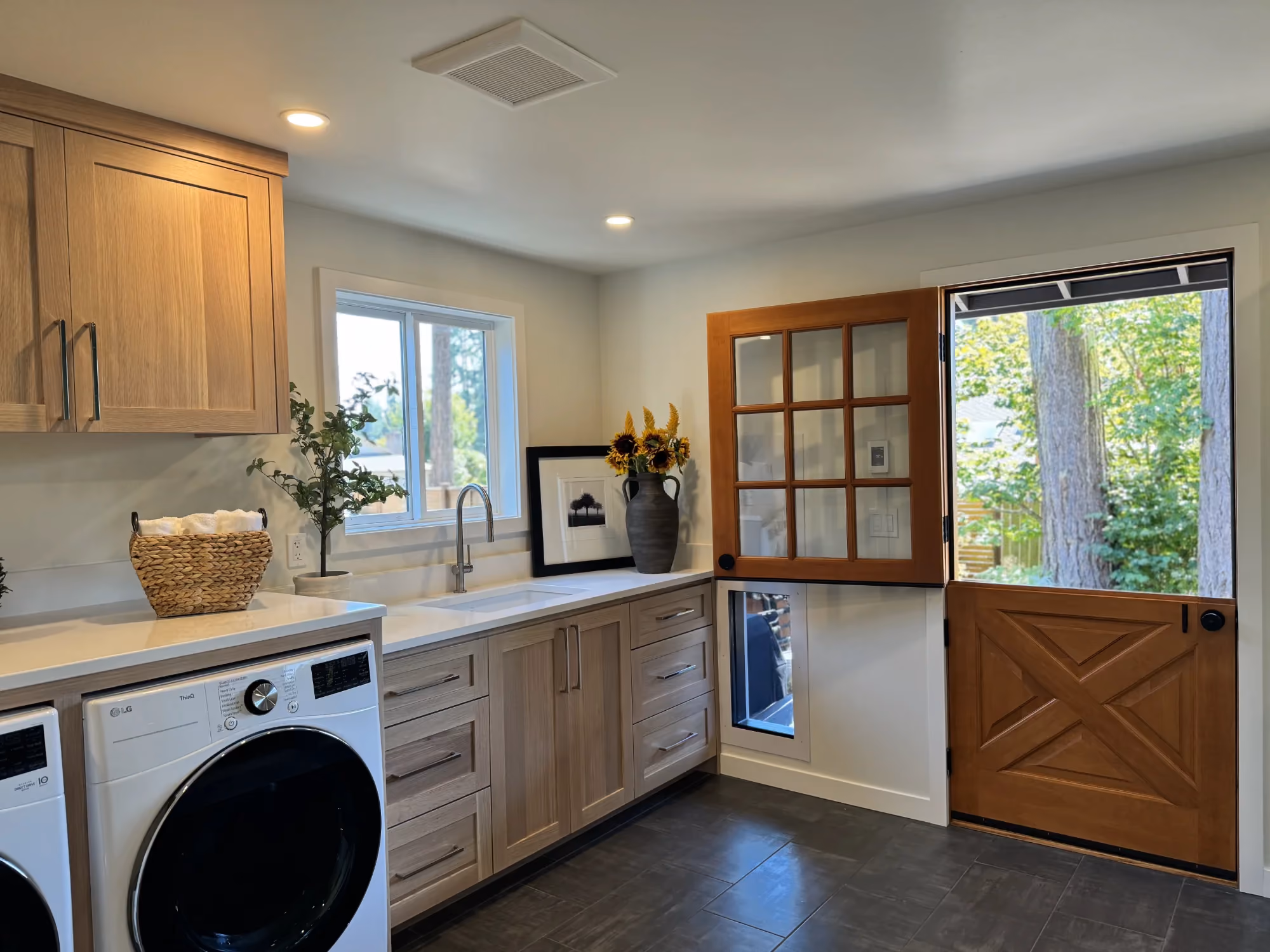 Laundry/mudroom with built-in cabinets and exterior door