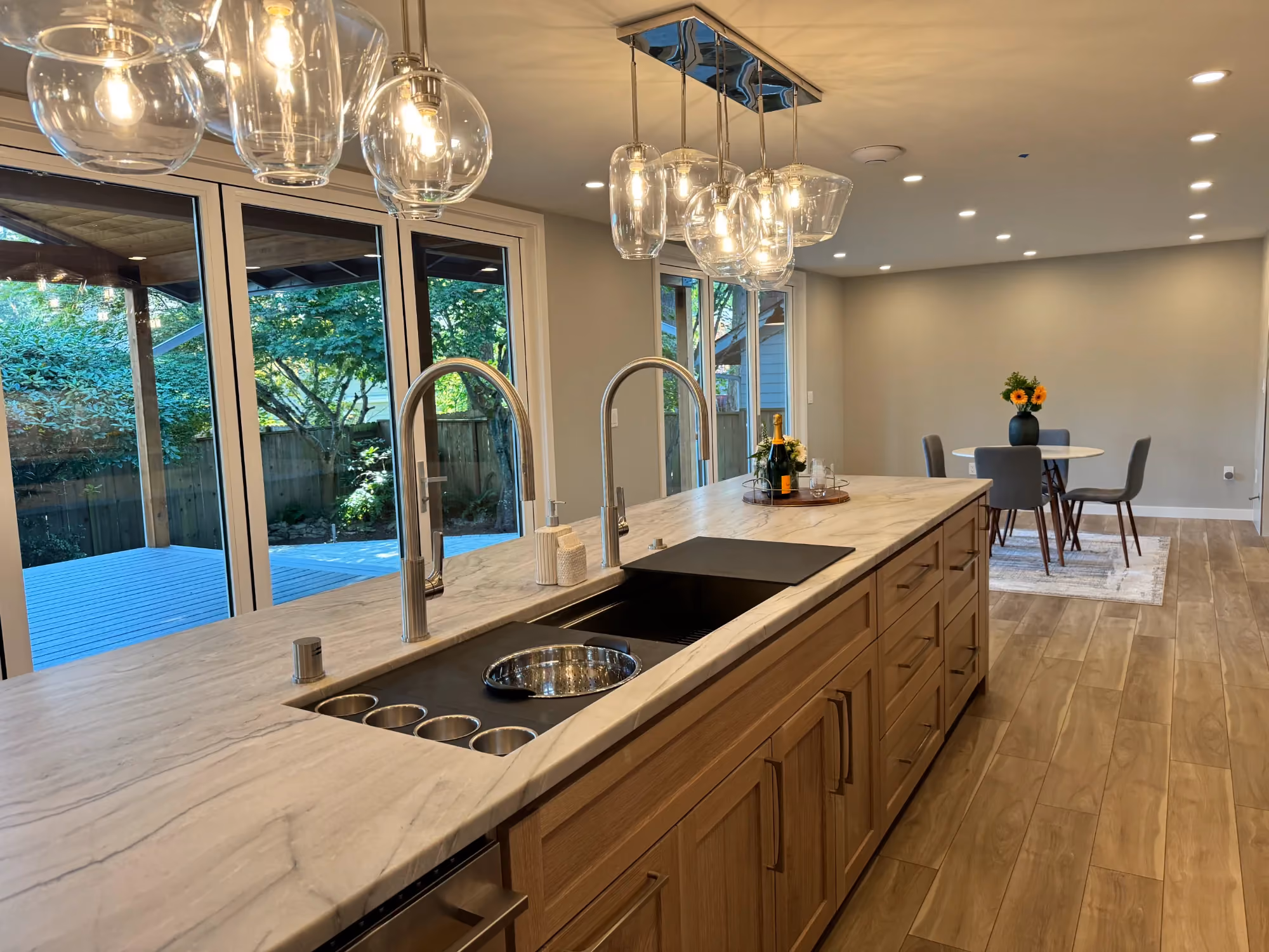 Modern kitchen island with sink and pendant lighting