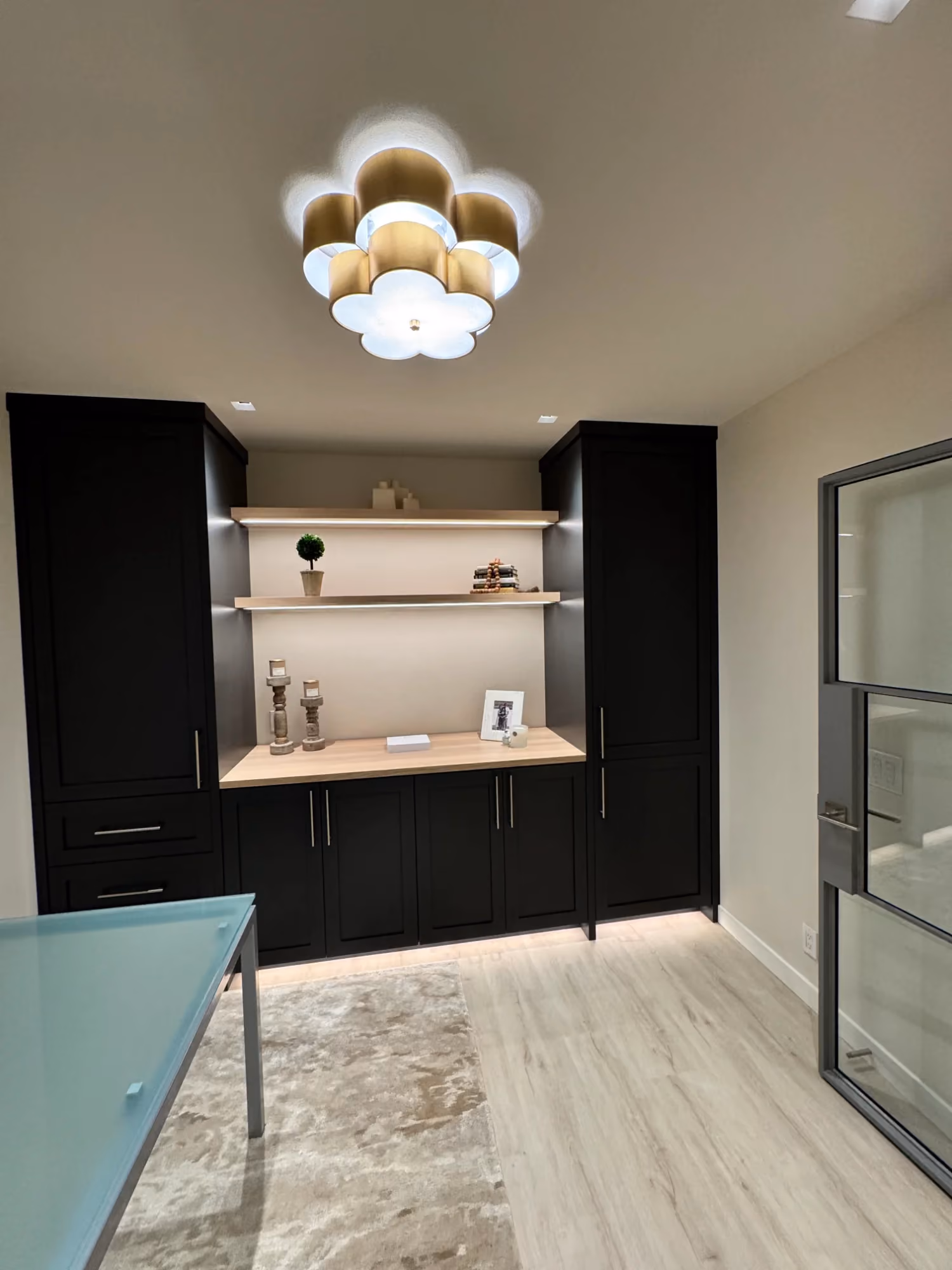 Modern kitchen with dark cabinets and pendant light