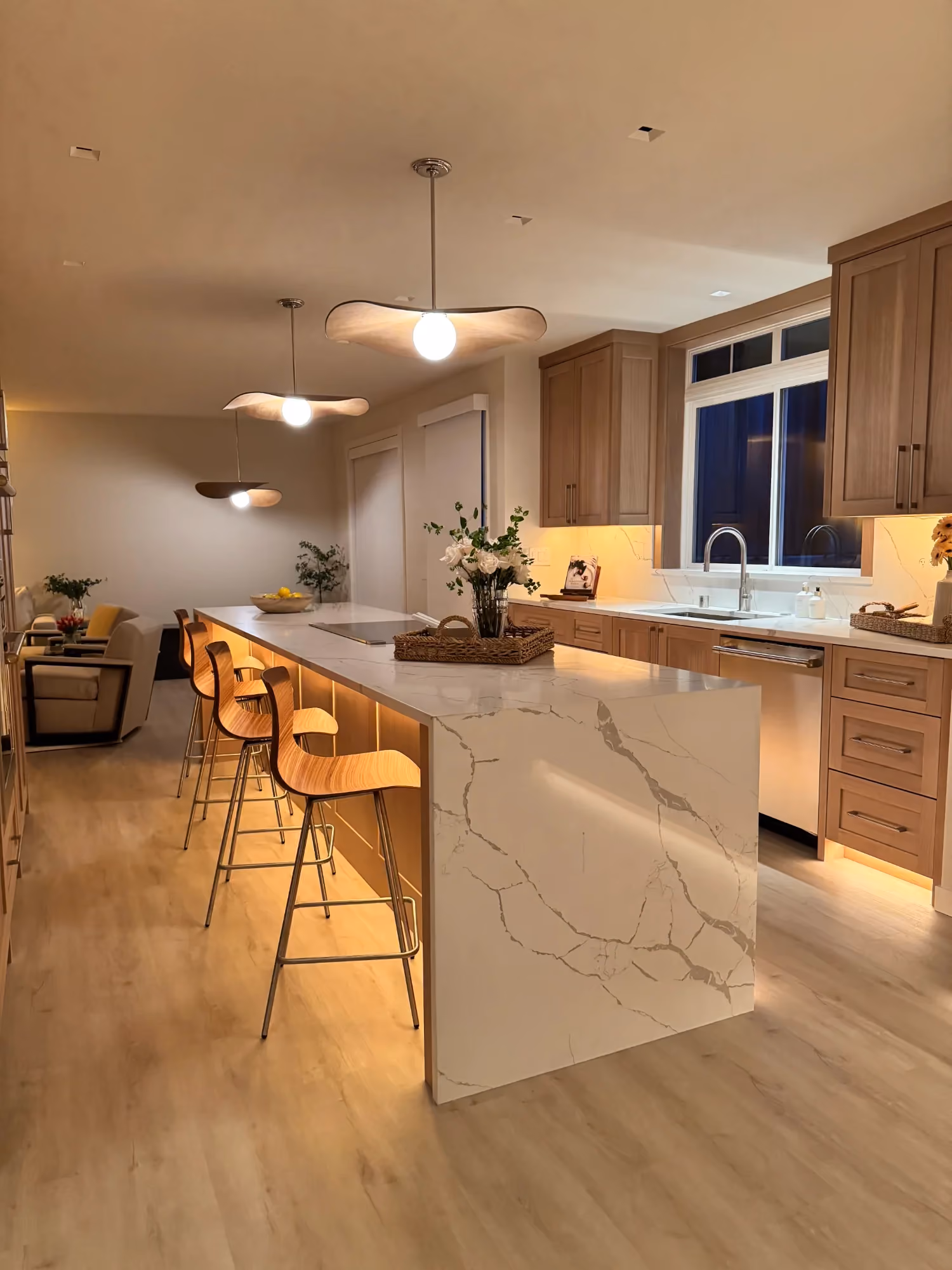 Open-concept kitchen with island and stools