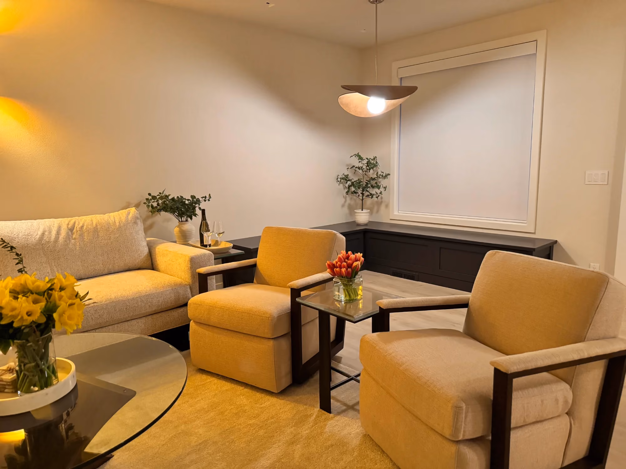 Living room with sofas and yellow armchair