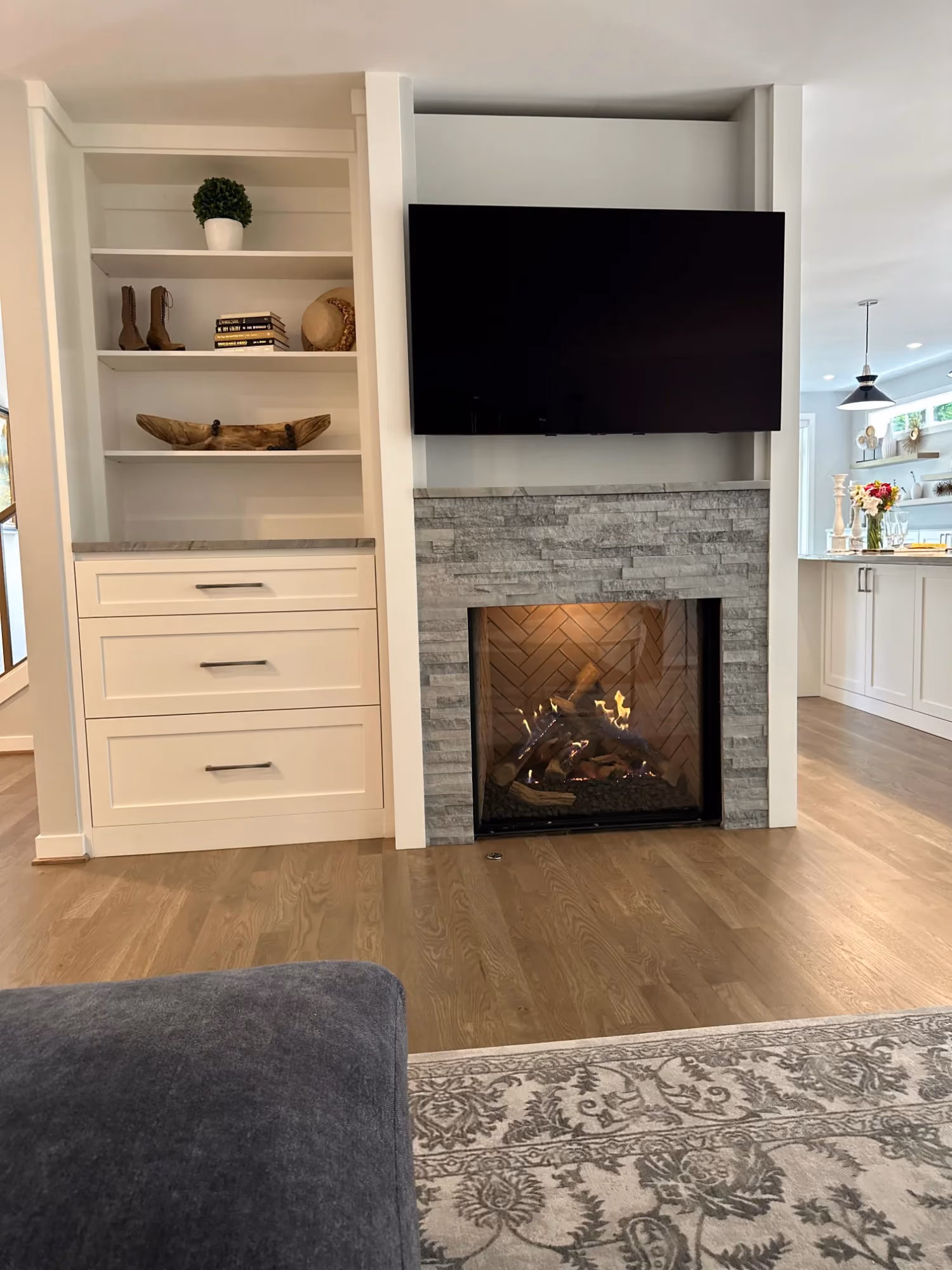 Built-in shelves and fireplace with wall-mounted TV