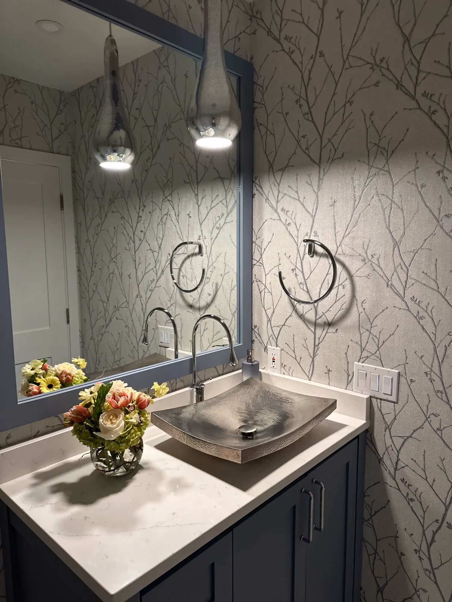 Bathroom vanity with mirror and wall lights