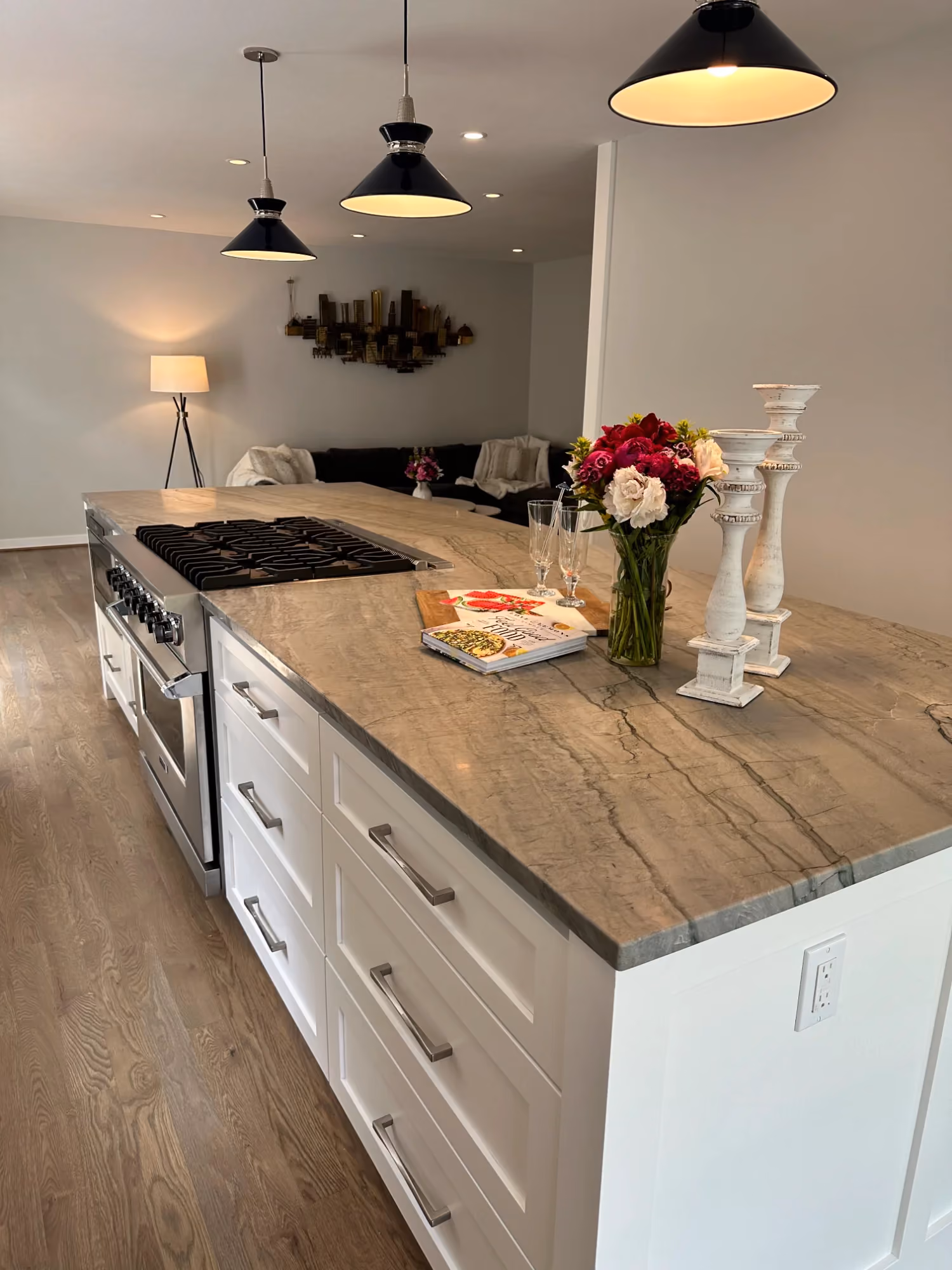 Kitchen island with pendant lights and flowers