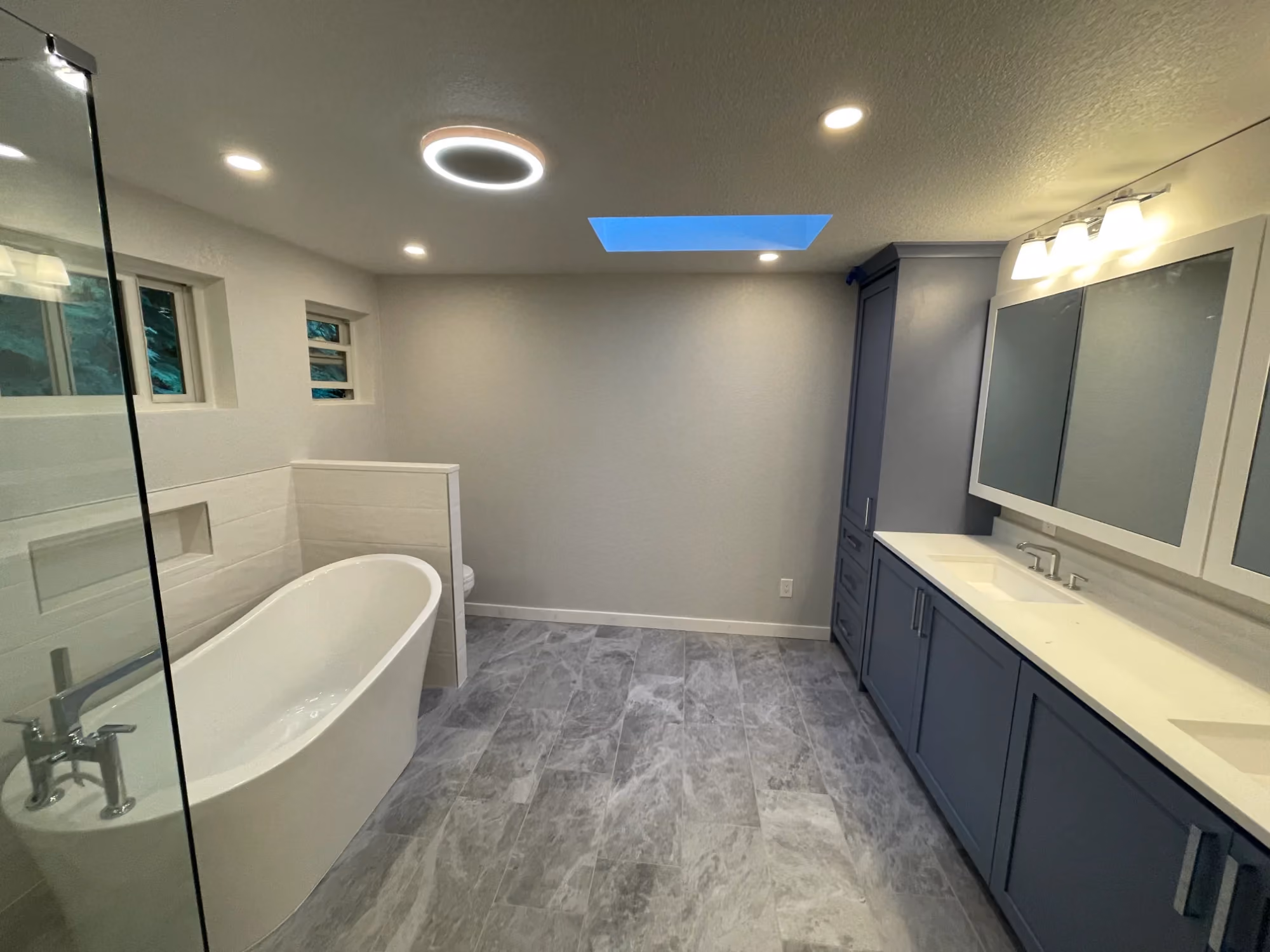 Modern bathroom with freestanding tub and double vanity