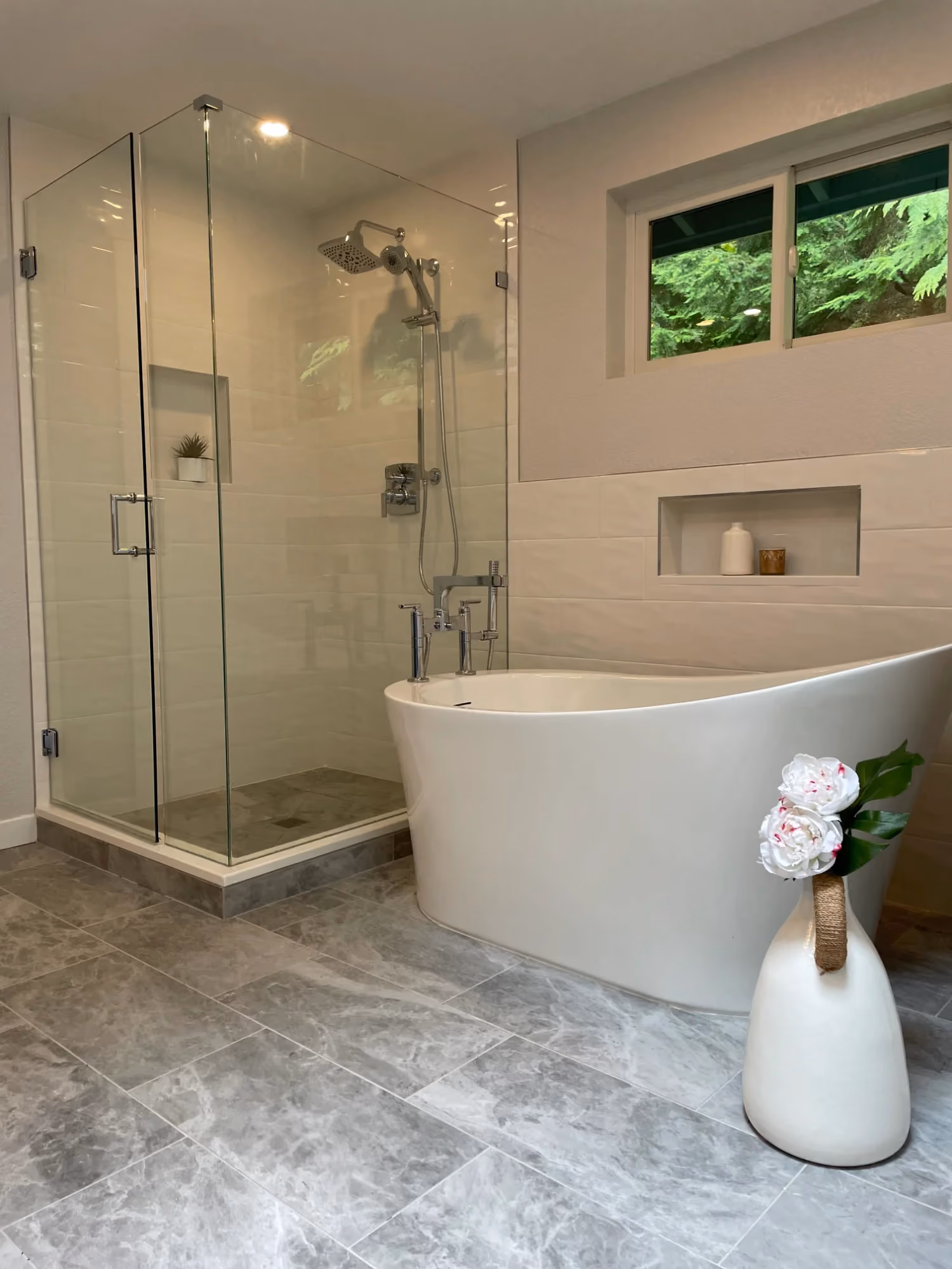 Bathroom with freestanding tub and glass shower