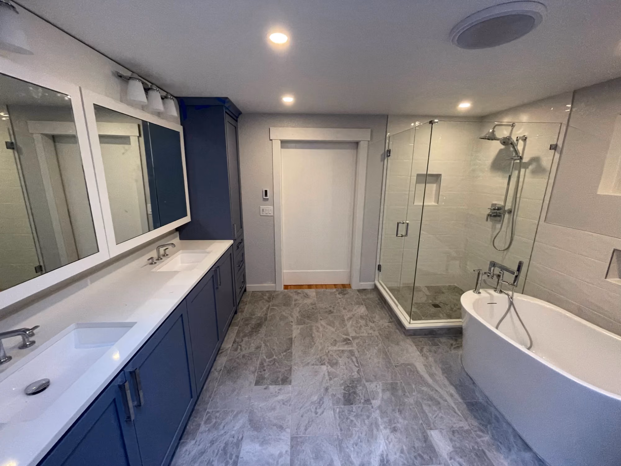 Double vanity and glass shower in modern bathroom