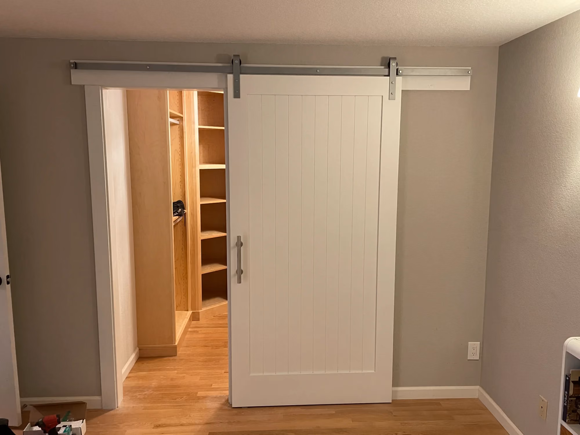 White sliding closet doors in a bedroom