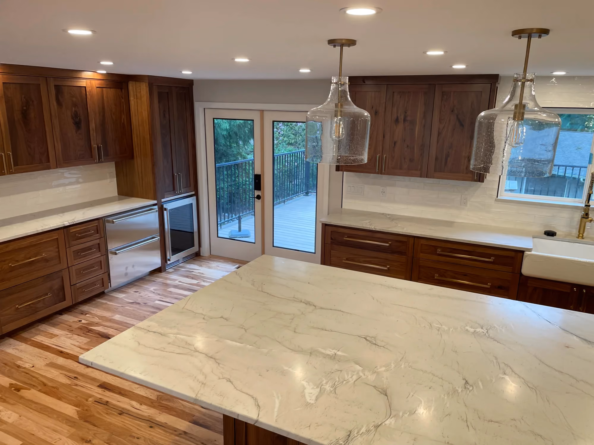 Kitchen view with large island and sliding glass door