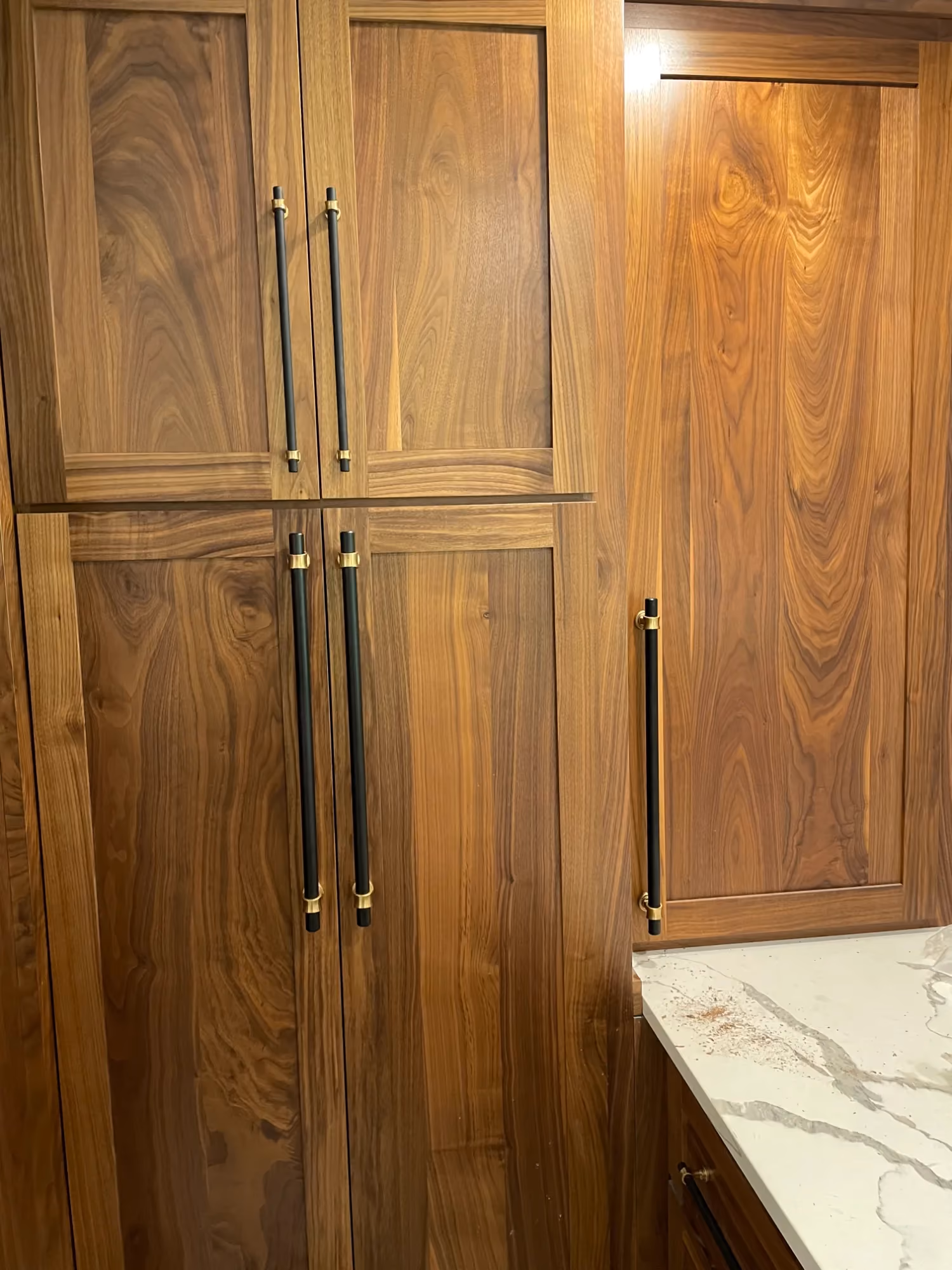 Wooden closet doors with brass handles