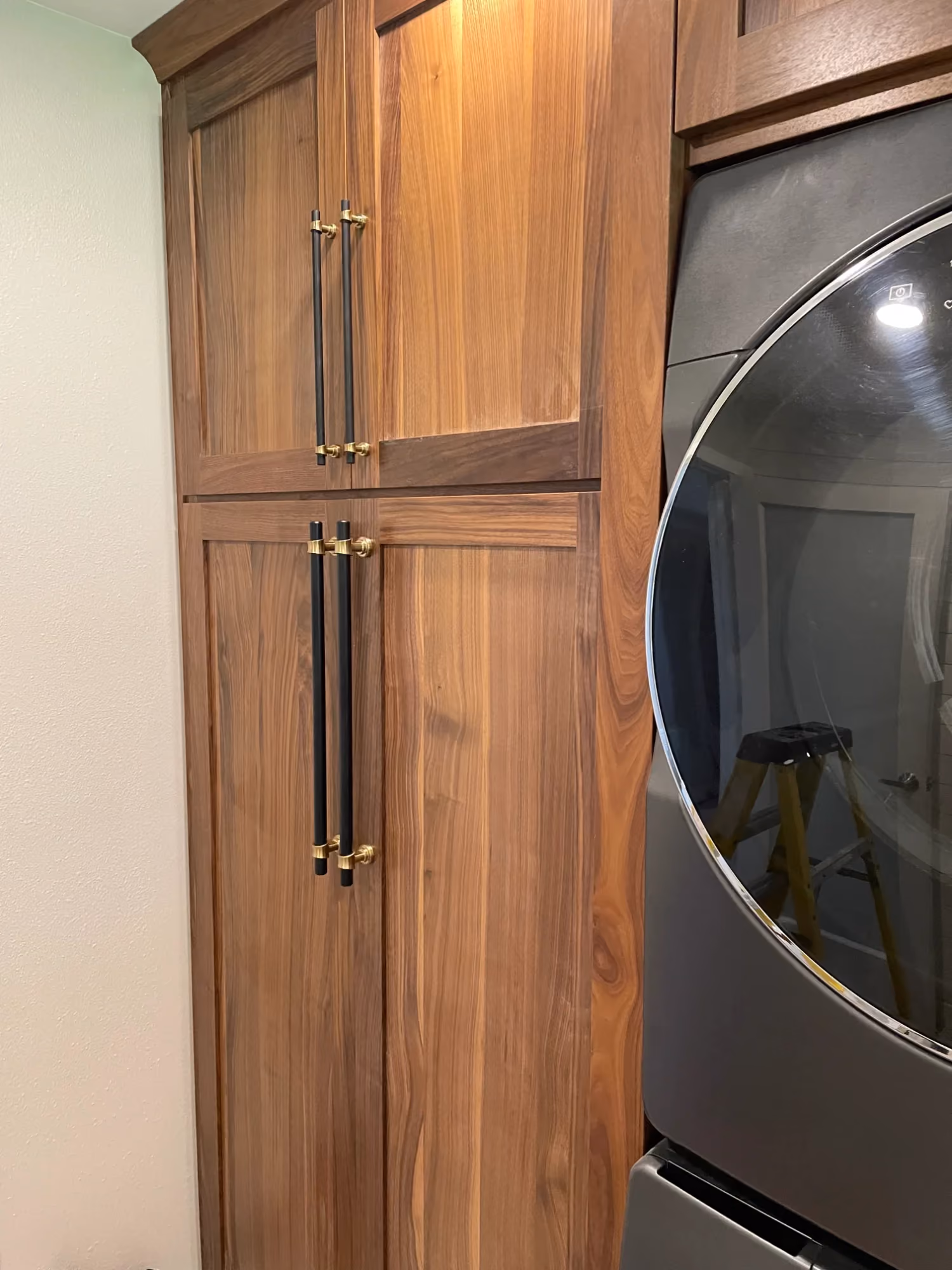 Wooden bathroom cabinet next to mirror