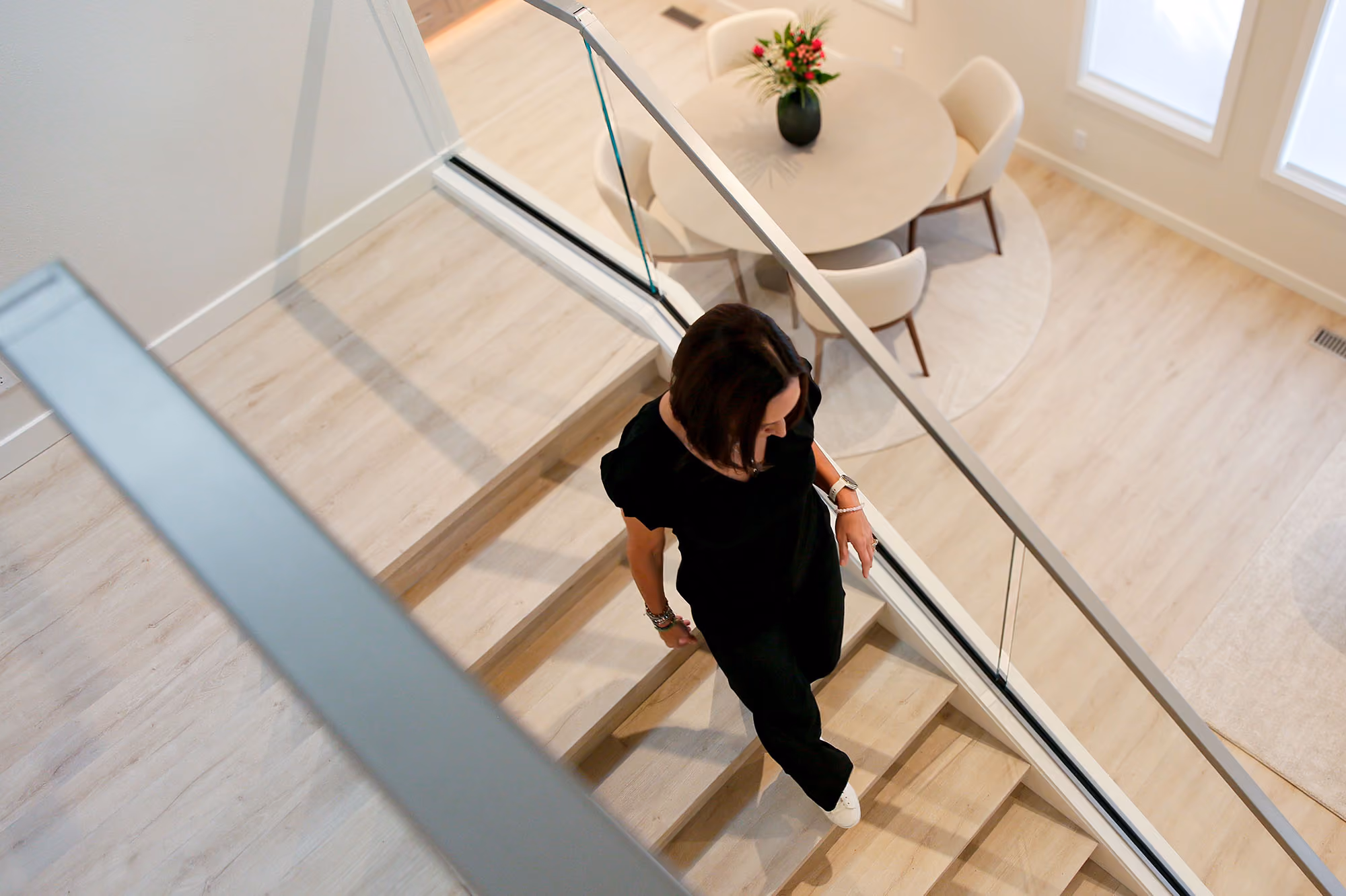 Women walking up a modern staircase