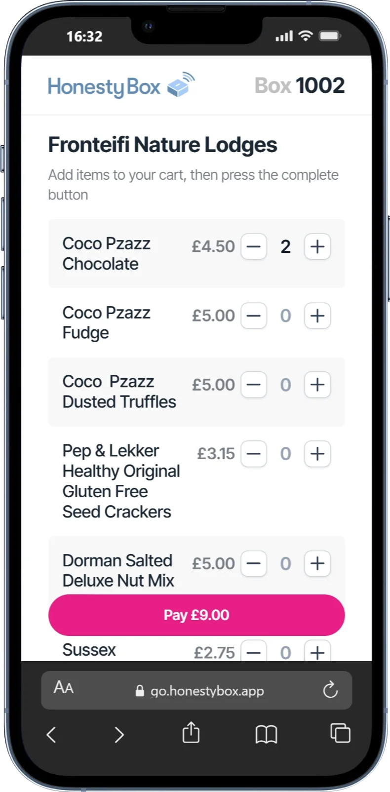 Mobile screen showing HonestyBox app for Fronteifi Nature Lodges with a cart containing 2 Coco Pzazz Chocolate priced £4.50 each and a pay button for £9.00.