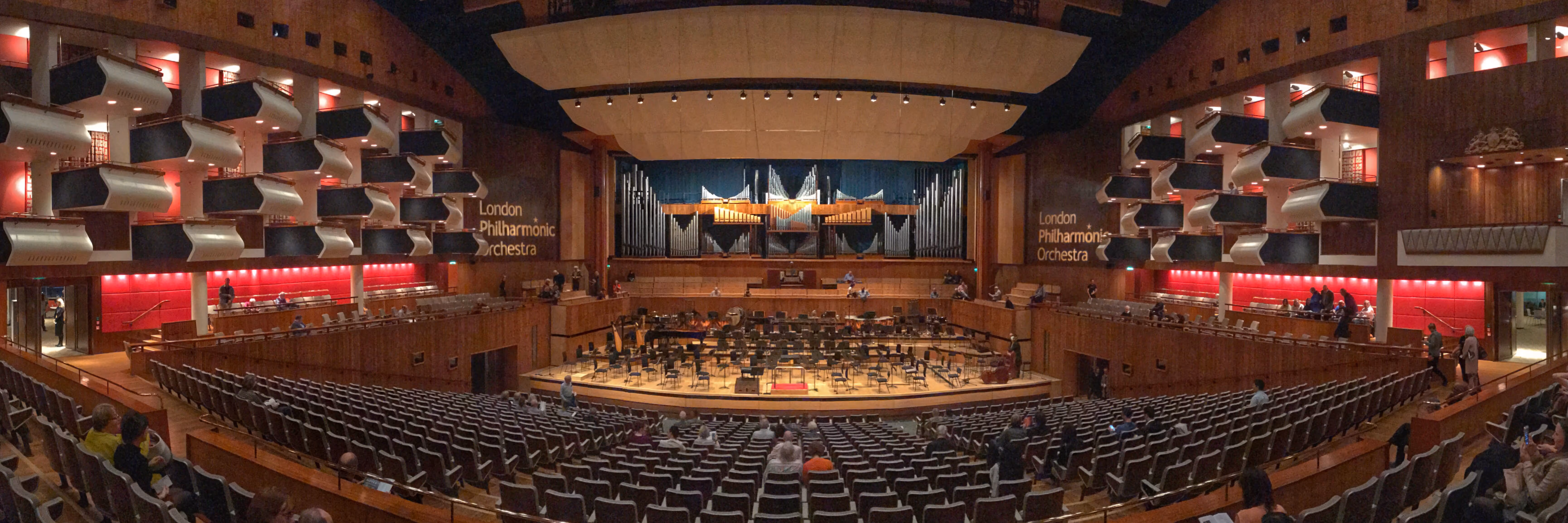Interior of Royal Festival Hall with stage, pipe organ, and seating for London Philharmonic Orchestra.