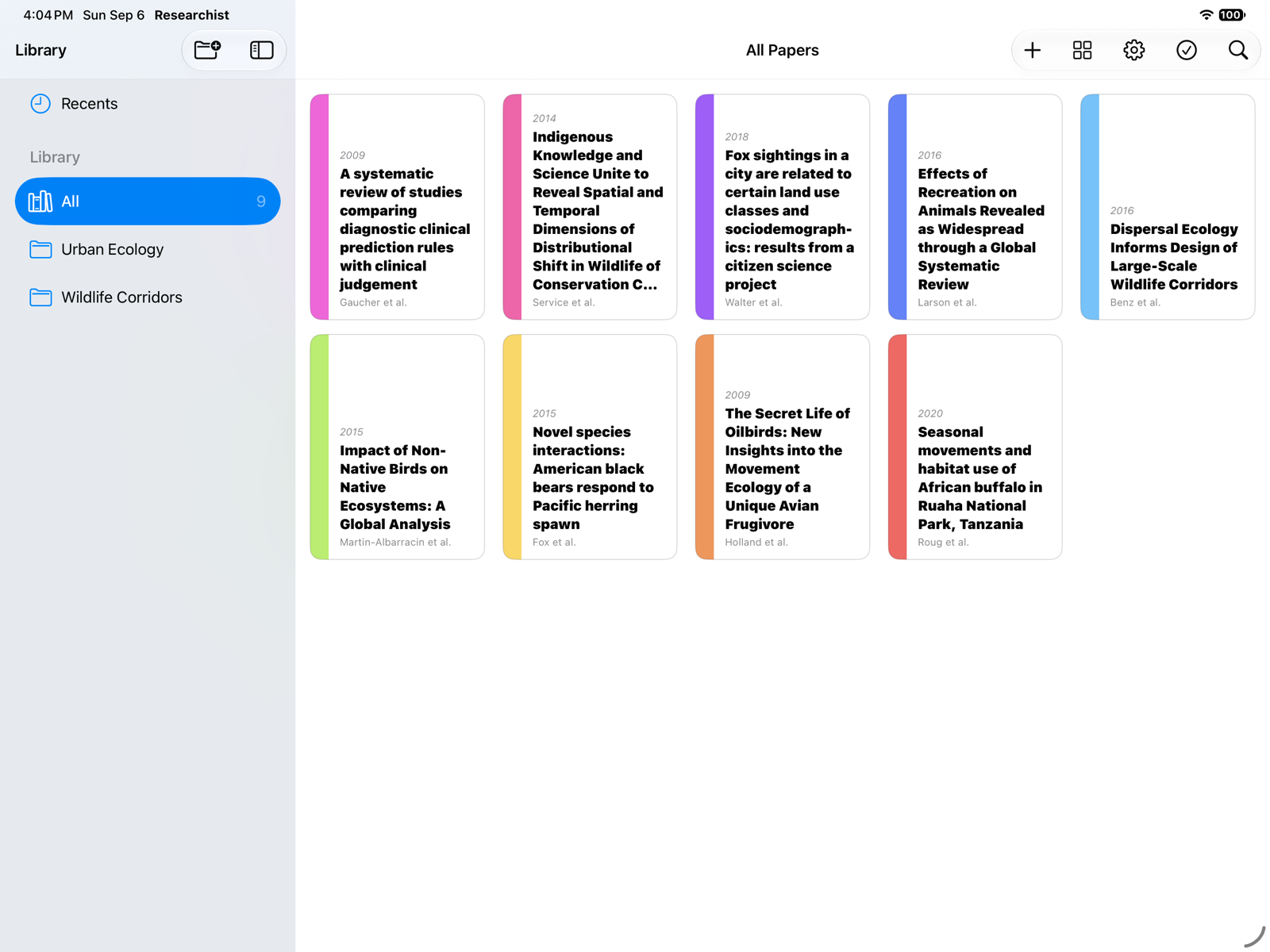 The Researchist library in grid view with nine papers and two collections in the sidebar