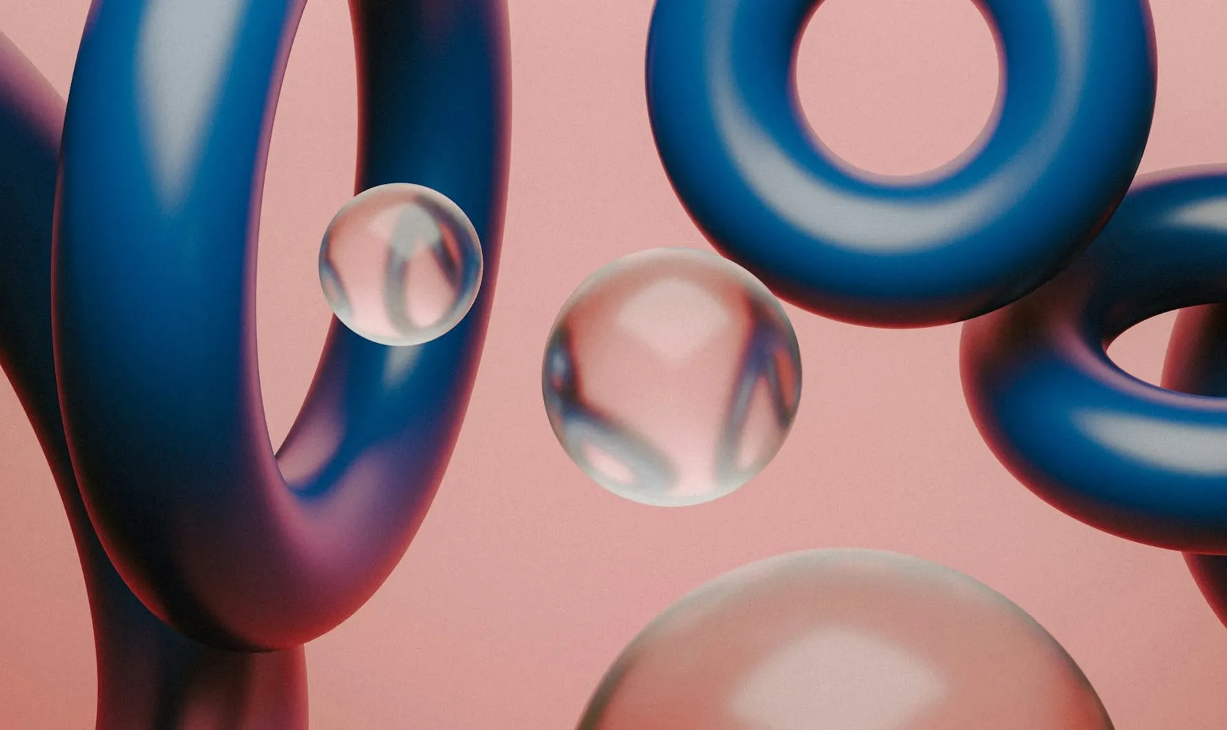 Abstract composition of blue torus shapes and transparent spheres against a soft pink background.