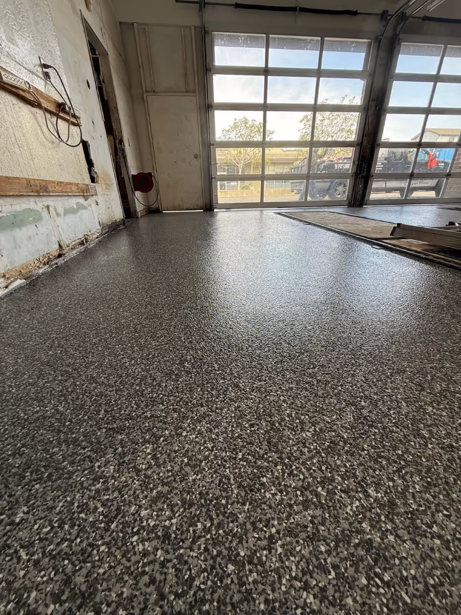 Gray flake floor running to the glazed frontage of a commercial unit