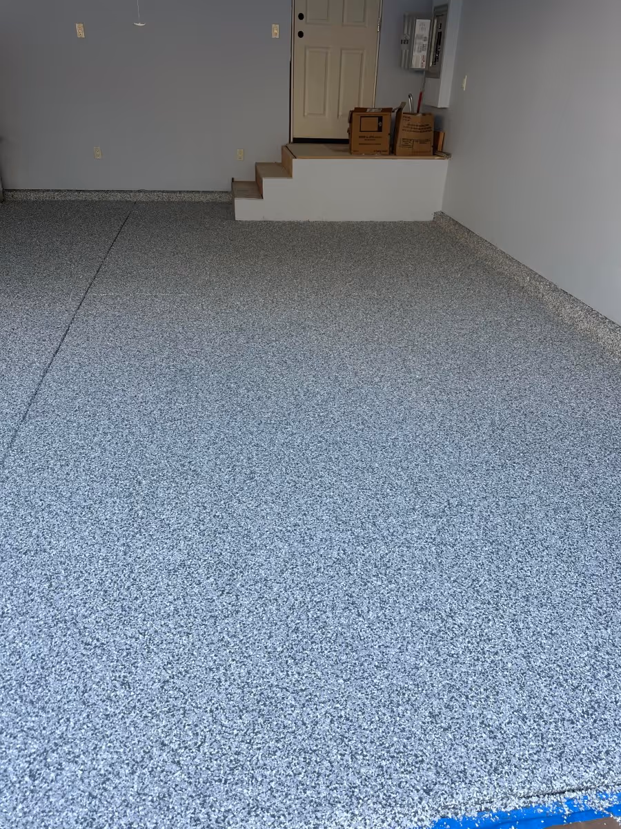 Light gray epoxy flake garage floor with interior steps