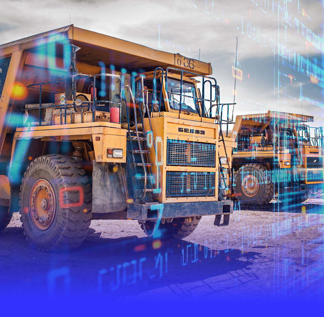 Two large yellow mining dump trucks parked on dry ground with a numerical digital overlay.