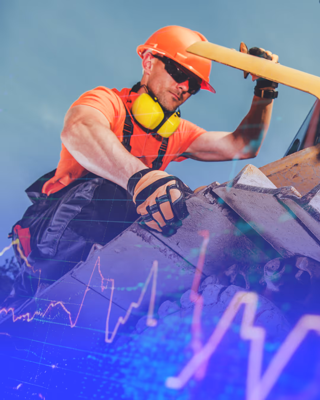 Construction worker in orange helmet and shirt inspecting heavy machinery with yellow ear protection around neck.