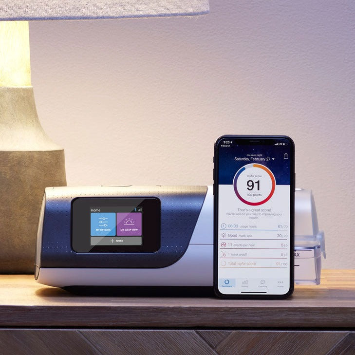 AirSense 11 on nightstand next to phone