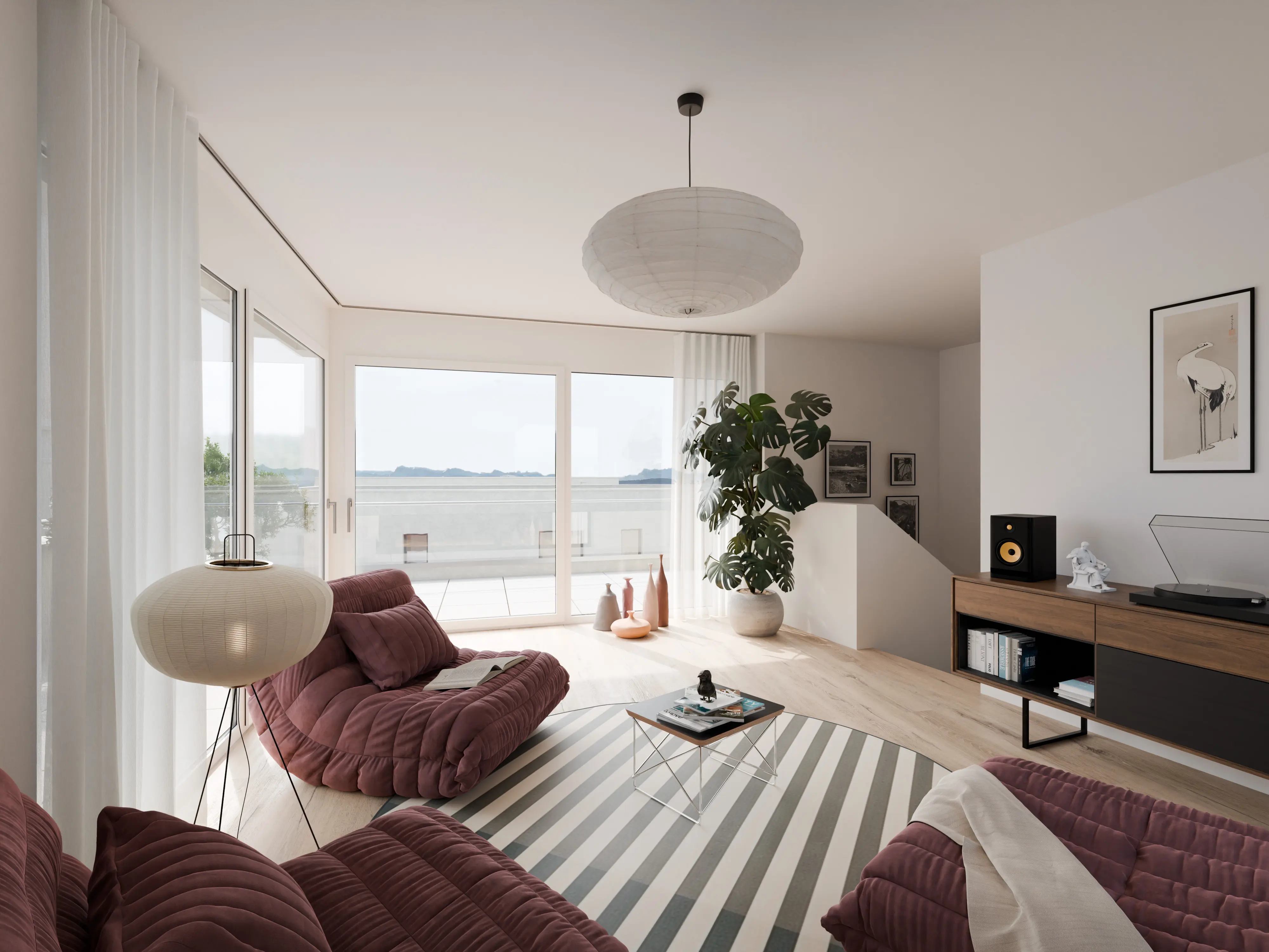 Salon lumineux avec canapés bordeaux, lampe sur trépied, table basse ronde à rayures et grande baie vitrée donnant sur une terrasse.