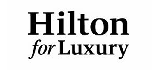 Hilton for Luxury text logo.
