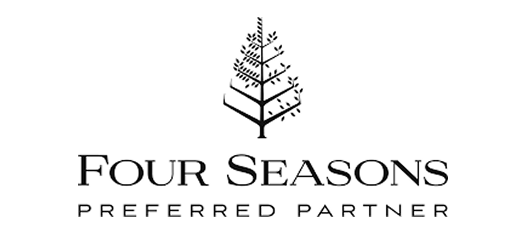 Four Seasons Preferred Partner logo featuring a stylized tree above the text.