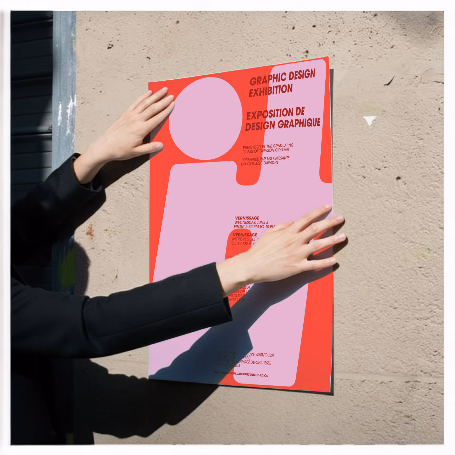 image generated by magnific AI  - Person in black sleeves putting up a graphic design exhibition poster on a textured wall.