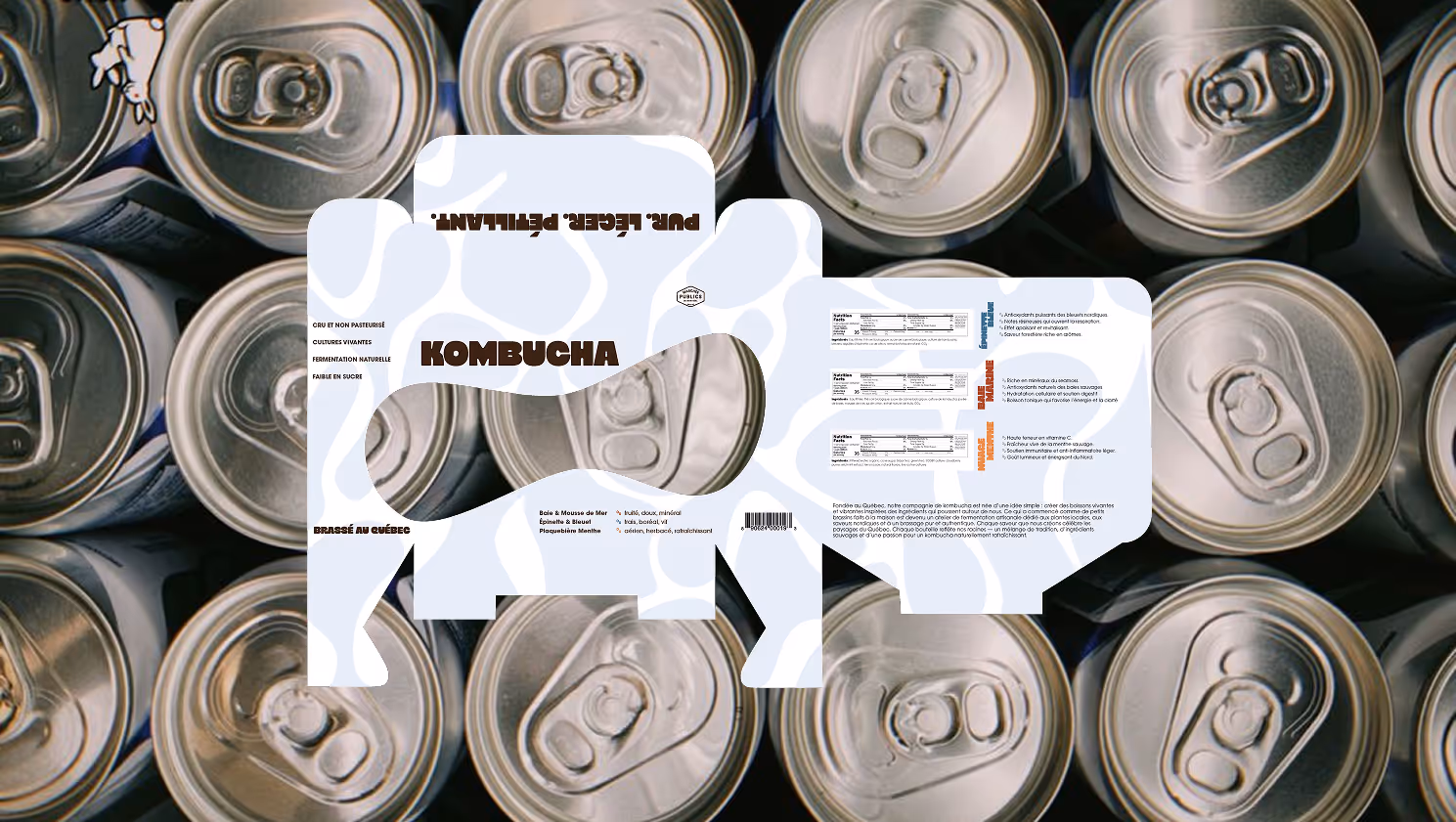 Kombucha label shaped like a cow with nutrition facts and flavor details in French over soda can tops.