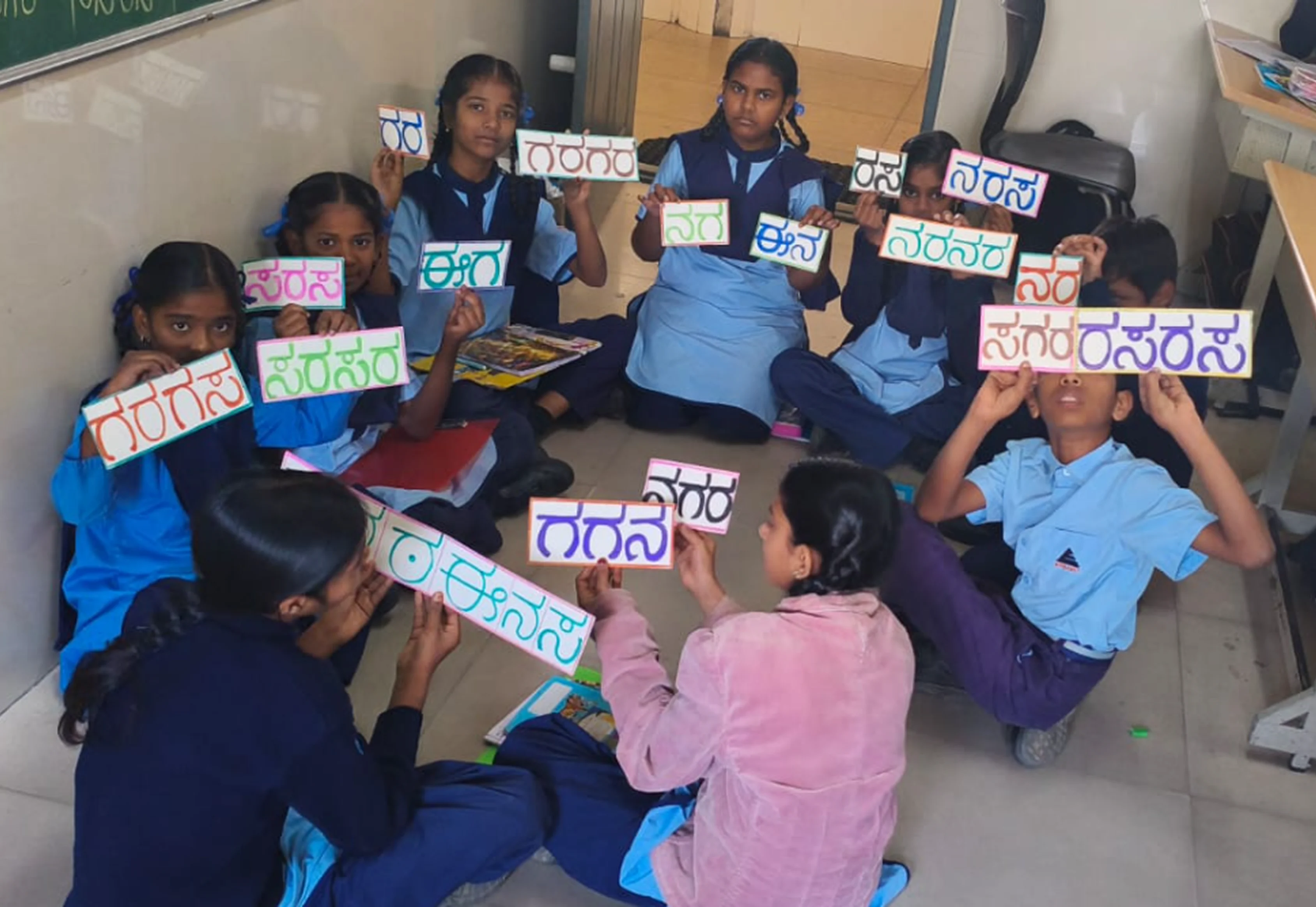 Students improving Kannada language skills in a classroom