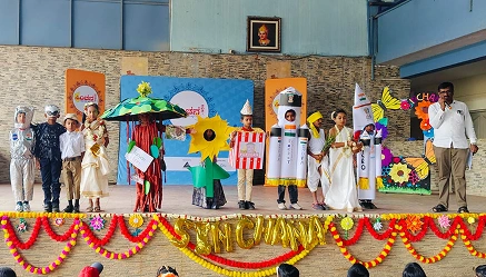 Students performing on stage during the Sinchana cultural celebration