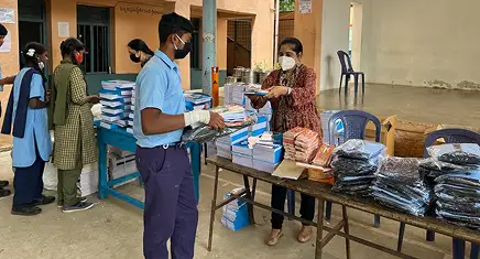 Distribution of learning starter kits to students at a government school