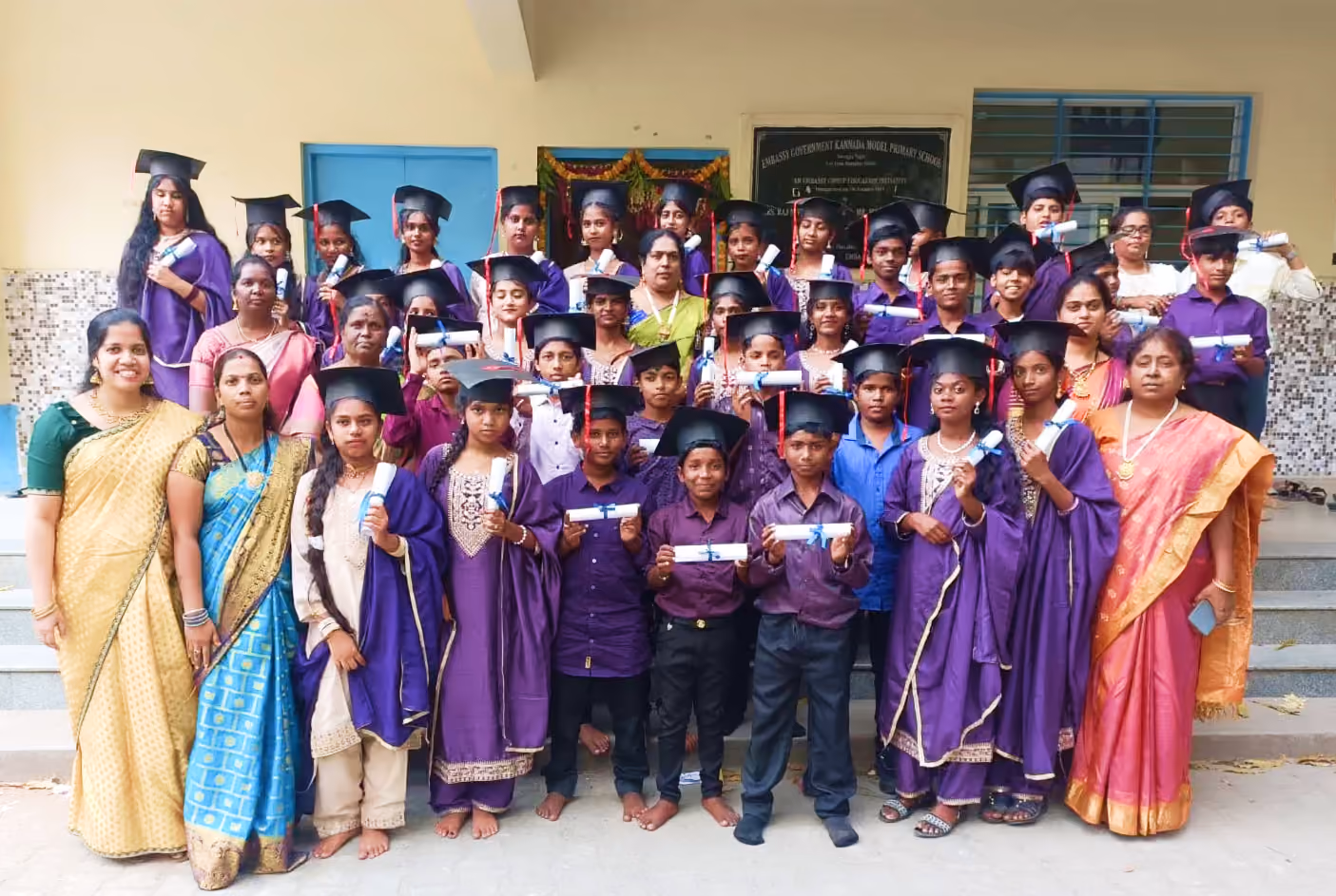 Students and teachers from a Colours of Life partner school posing together during a school program