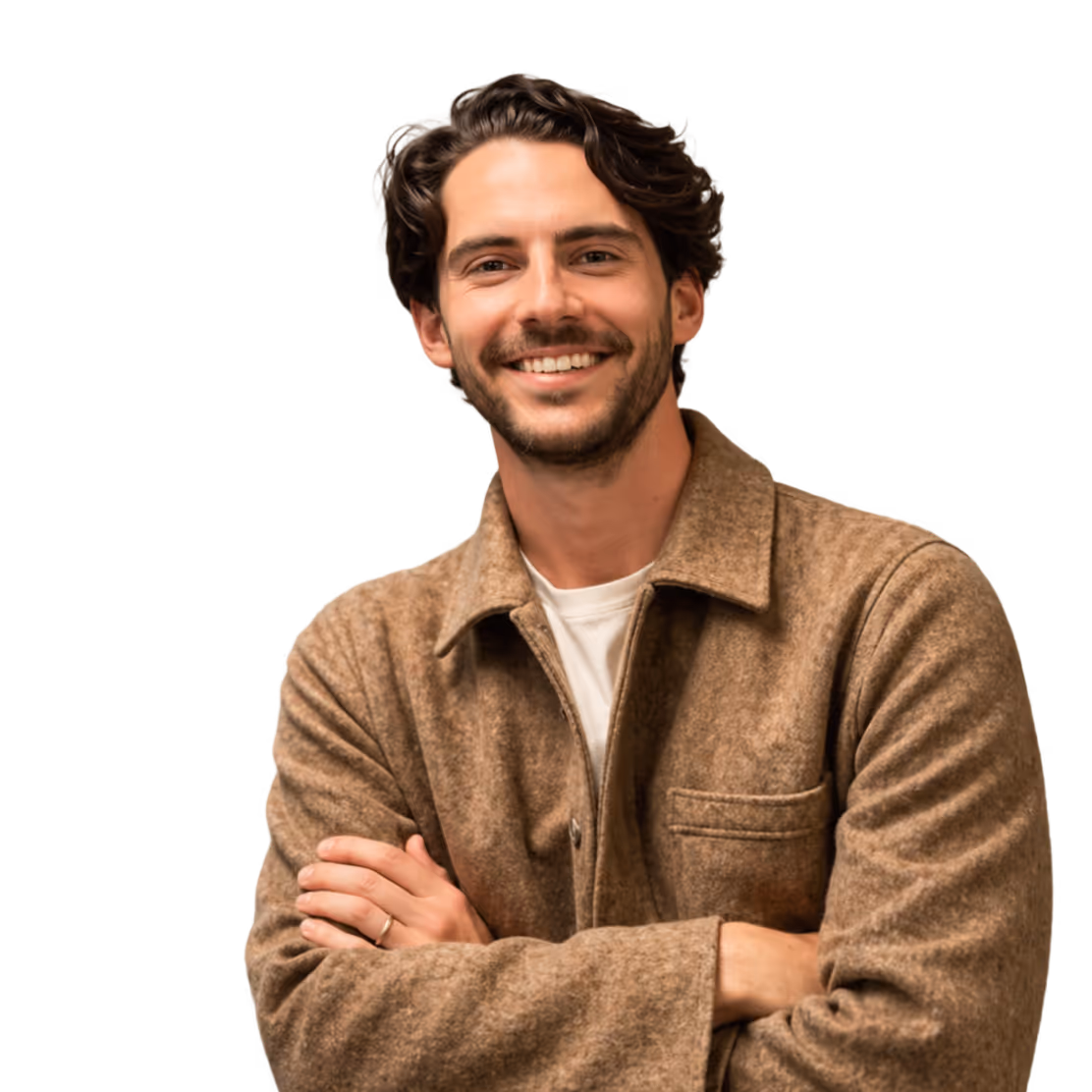 Smiling man with curly brown hair wearing a brown jacket and white shirt, arms crossed.