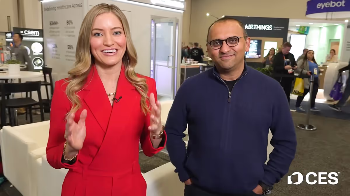Female host interviewing OnMed CEO Karthik Ganesh on the CES trade show floor