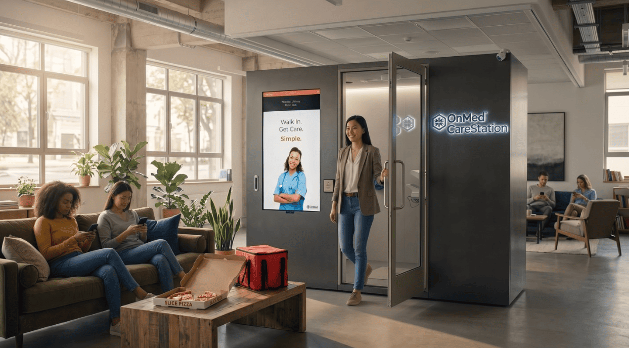Employee exiting an illuminated OnMed CareStation™ onsite healthcare kiosk in a modern, plant-filled office lounge with coworkers relaxing nearby.