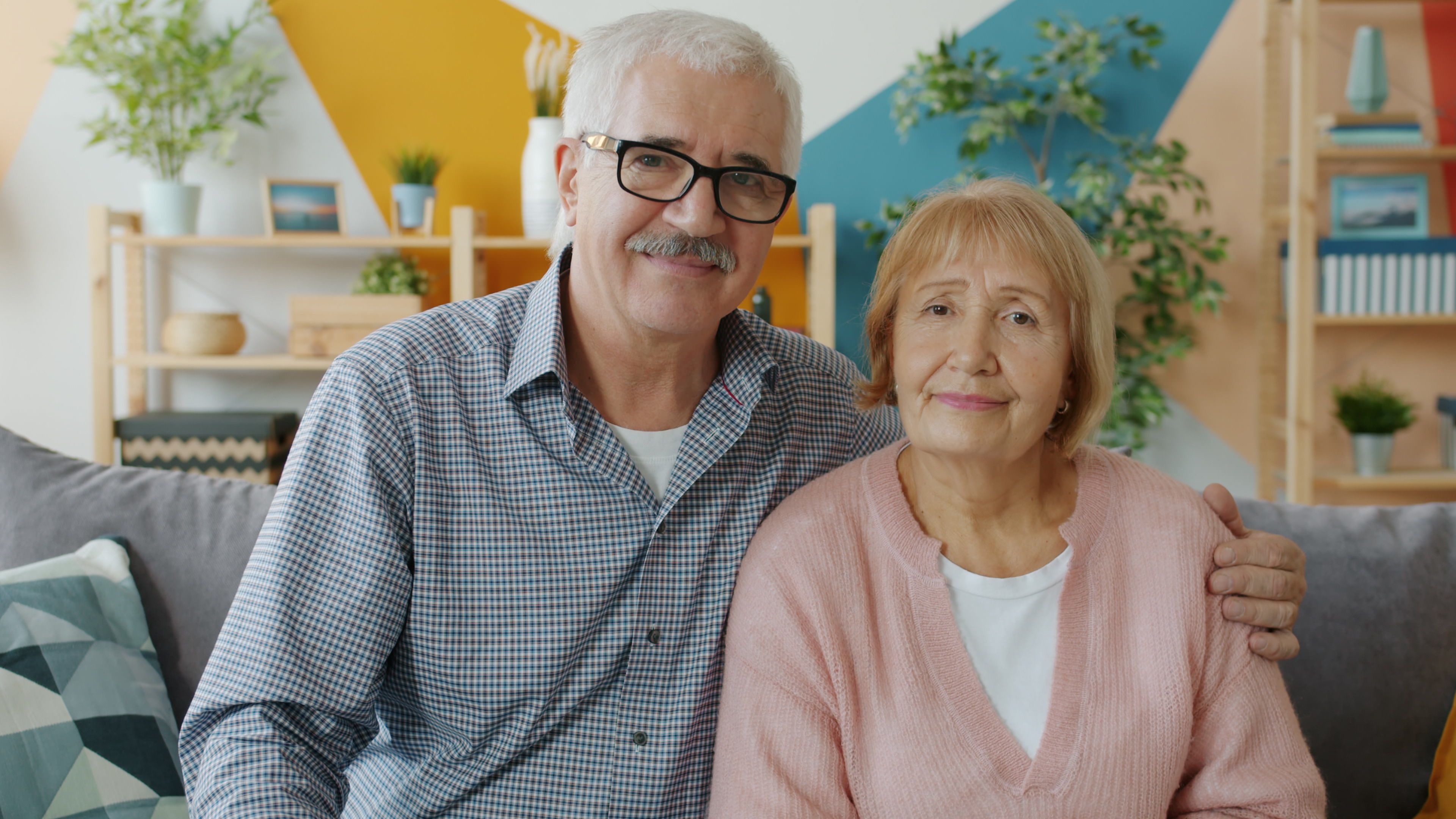 Senior couple sitting together at home, representing retirement and benefit protections established under ERISA.
